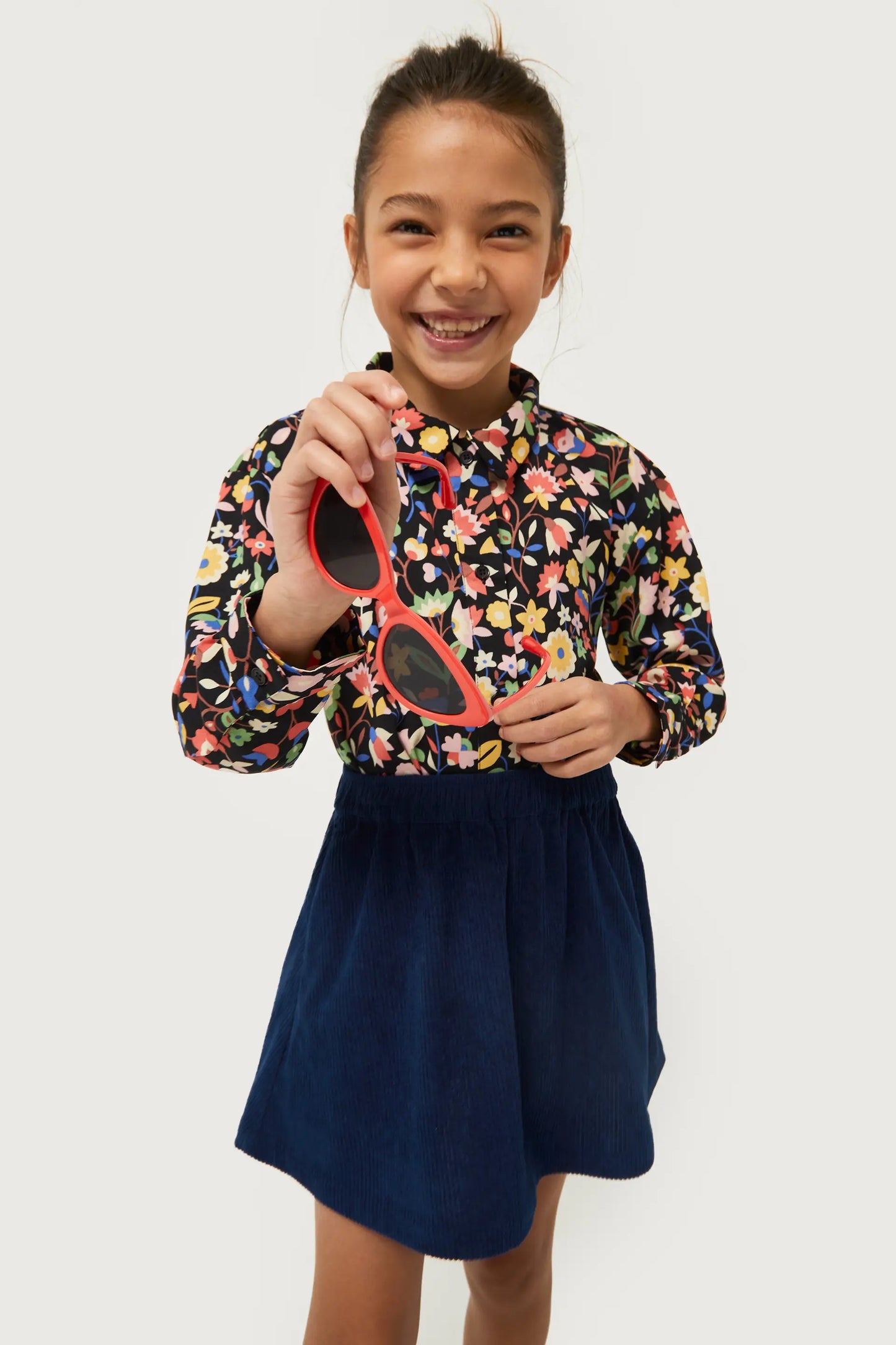 Falda corta de niña de pana azul marino