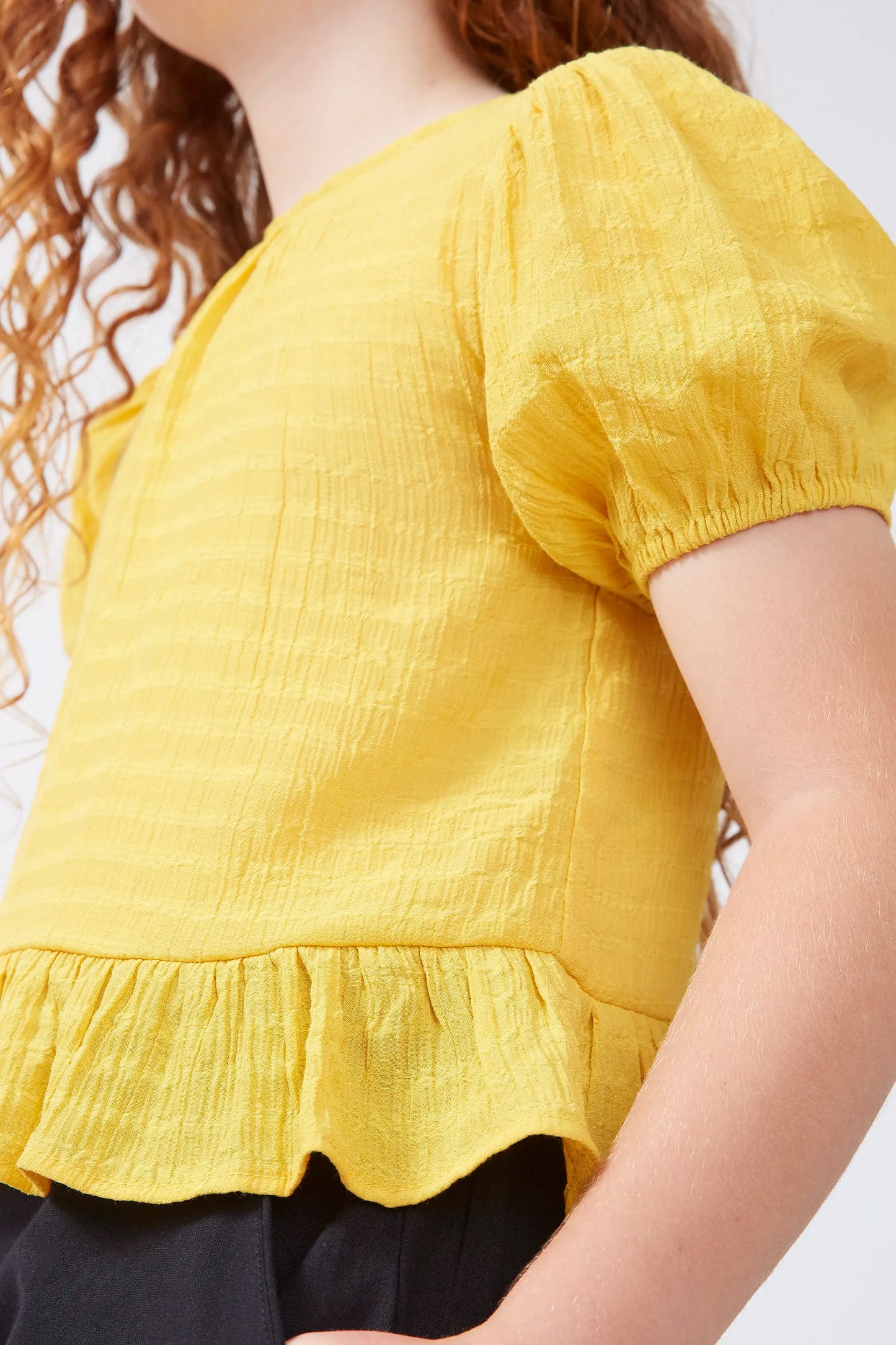 Top de niña volante amarillo