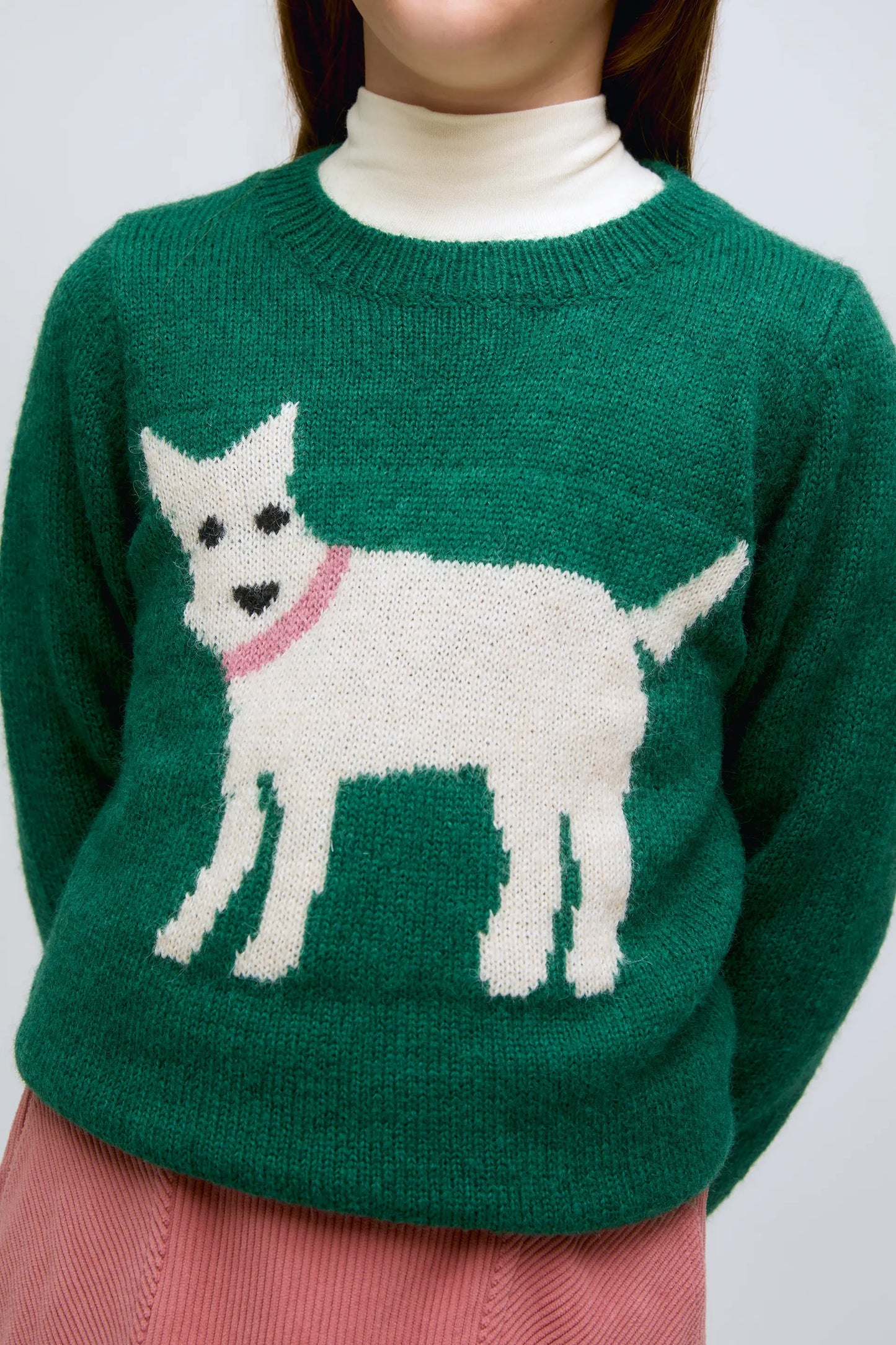 Green knitted girl's sweater with dog print