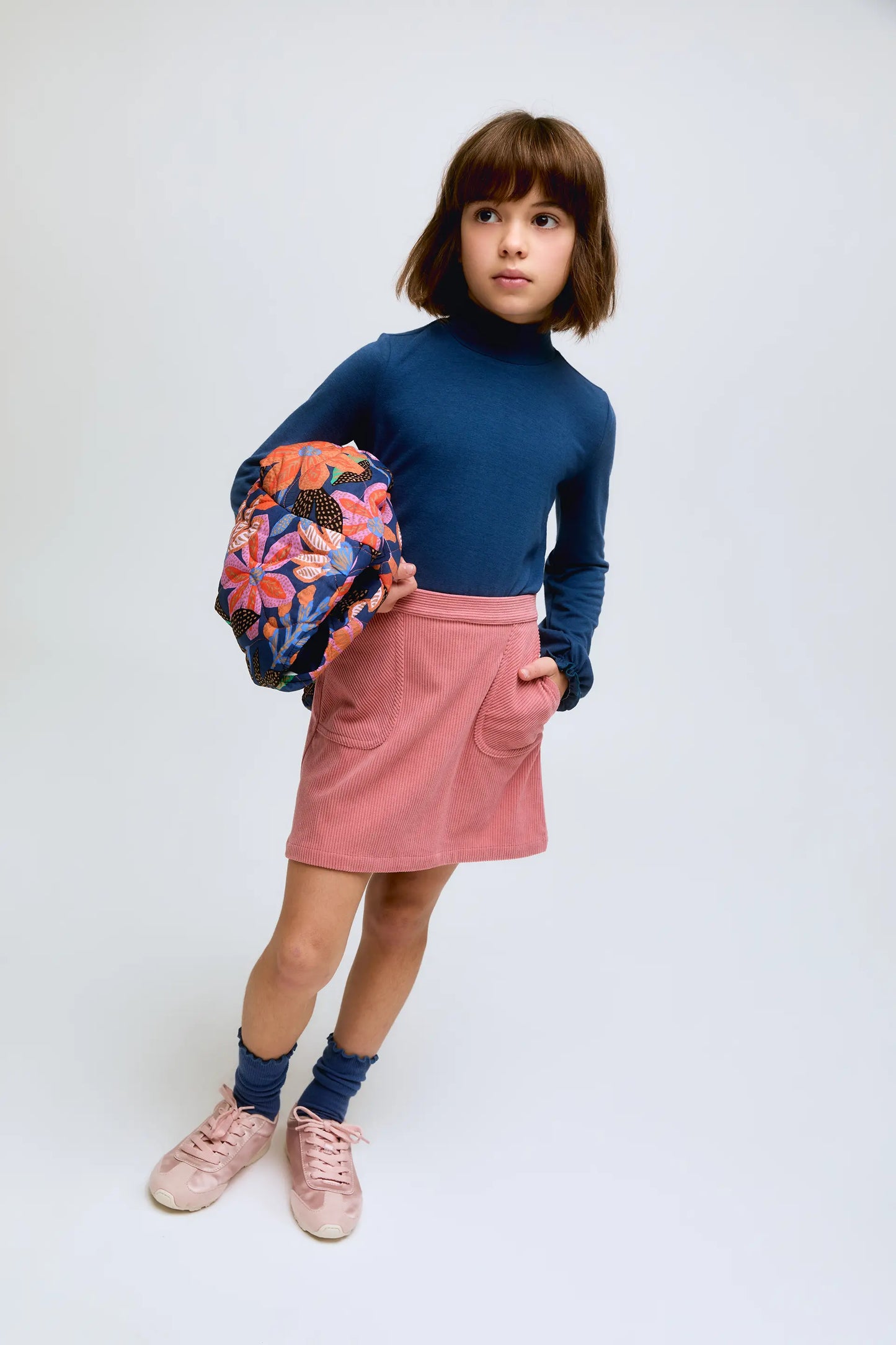 Blue girl's turtleneck sweater with gathered cuffs