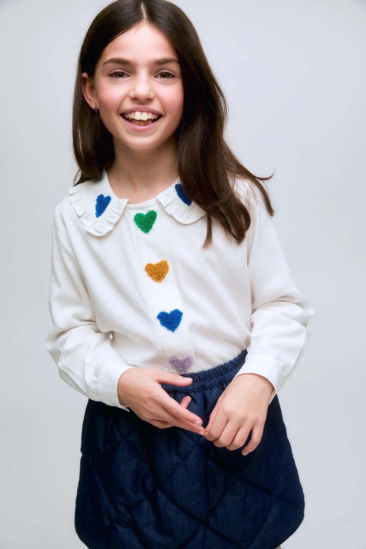 Girl's short skirt in quilted denim with elastic waist.