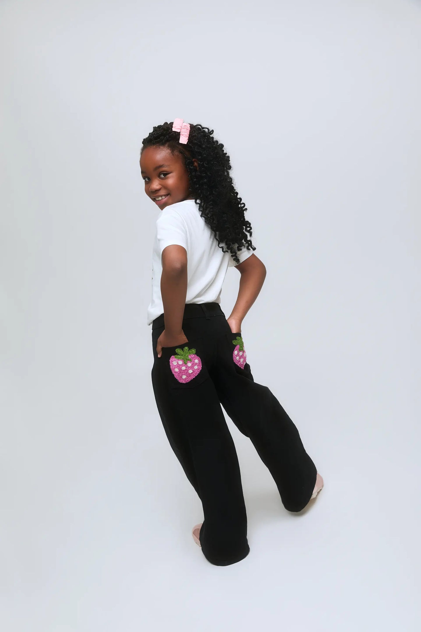 Girls' black jeans with strawberry detail on pockets
