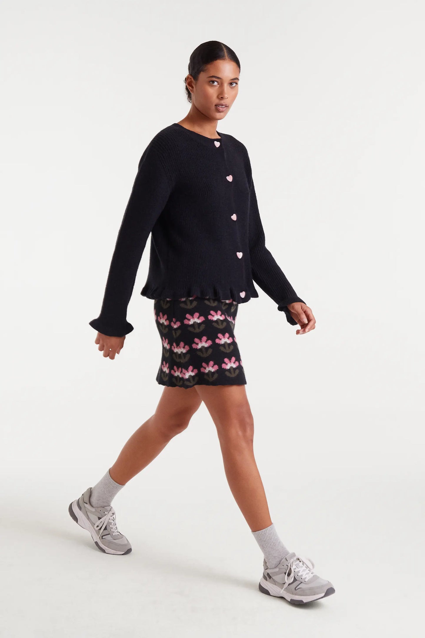 Black knit cardigan with heart detail