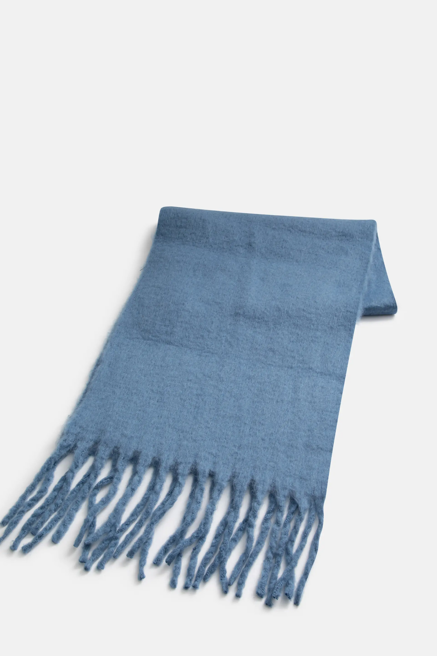 Knitted scarf with blue fringes