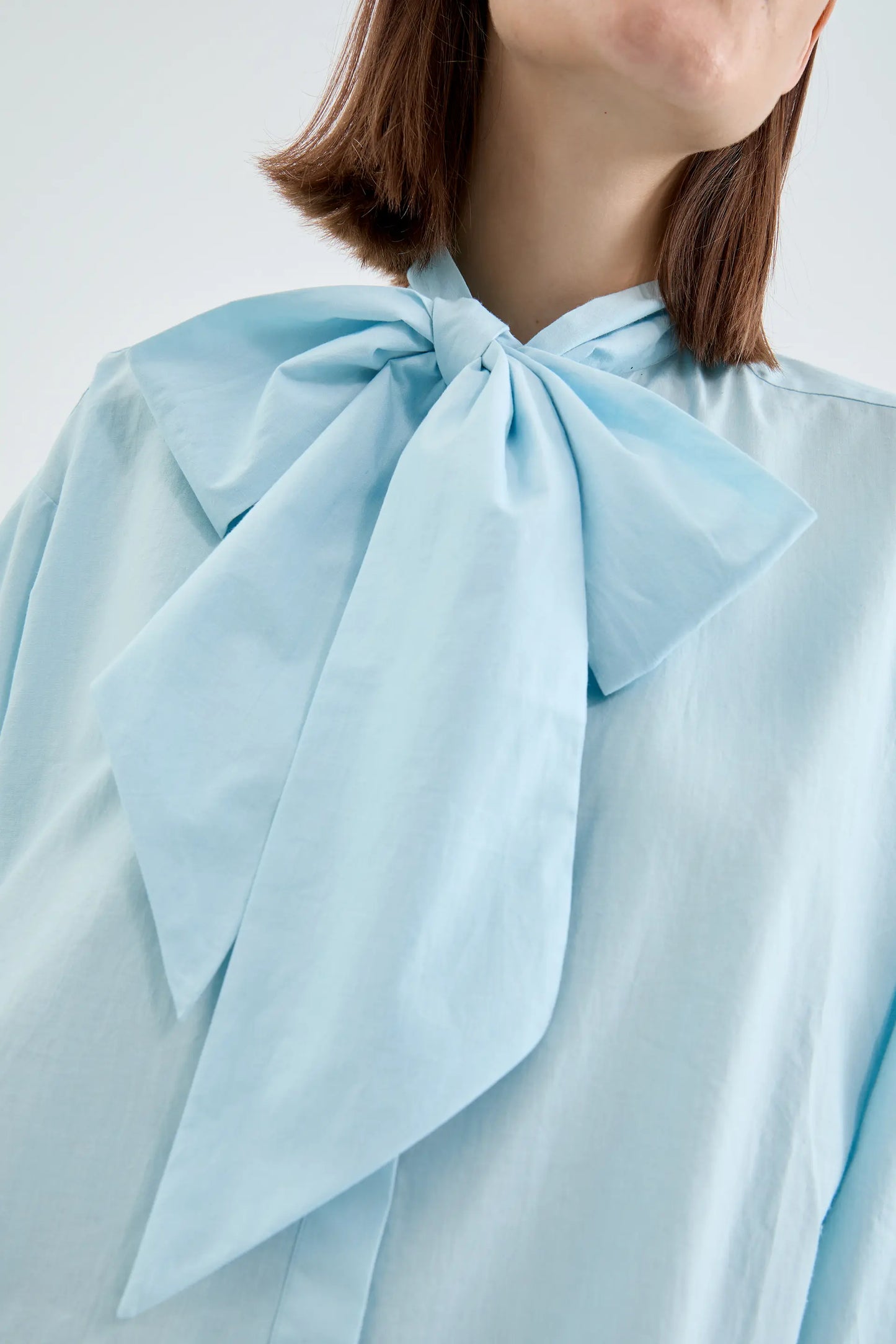 Oversize shirt with oversized blue bow