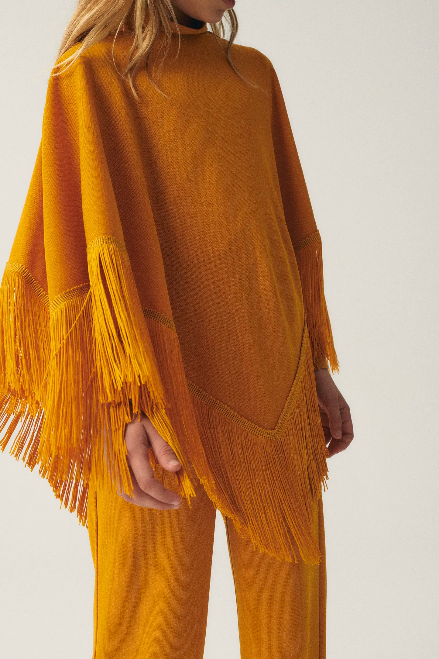 Girl's poncho with yellow fringes