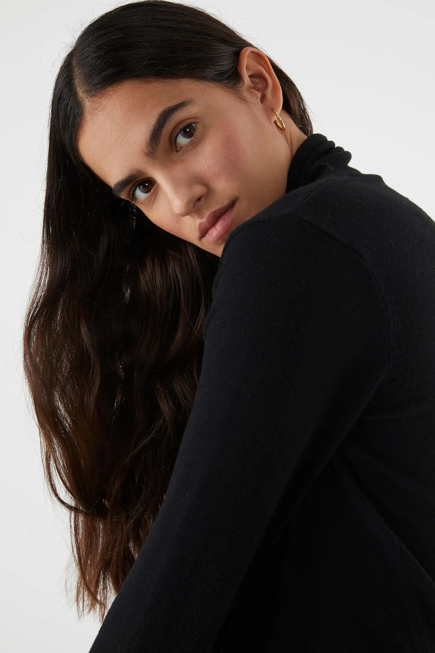 Fine knit sweater with black turtleneck