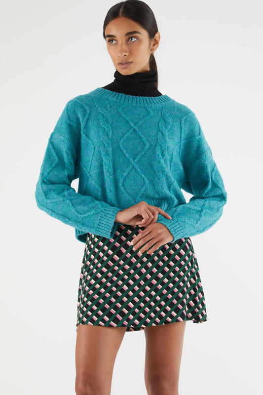 Short blue cable knit sweater