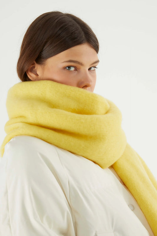 Long yellow knitted scarf with fringes