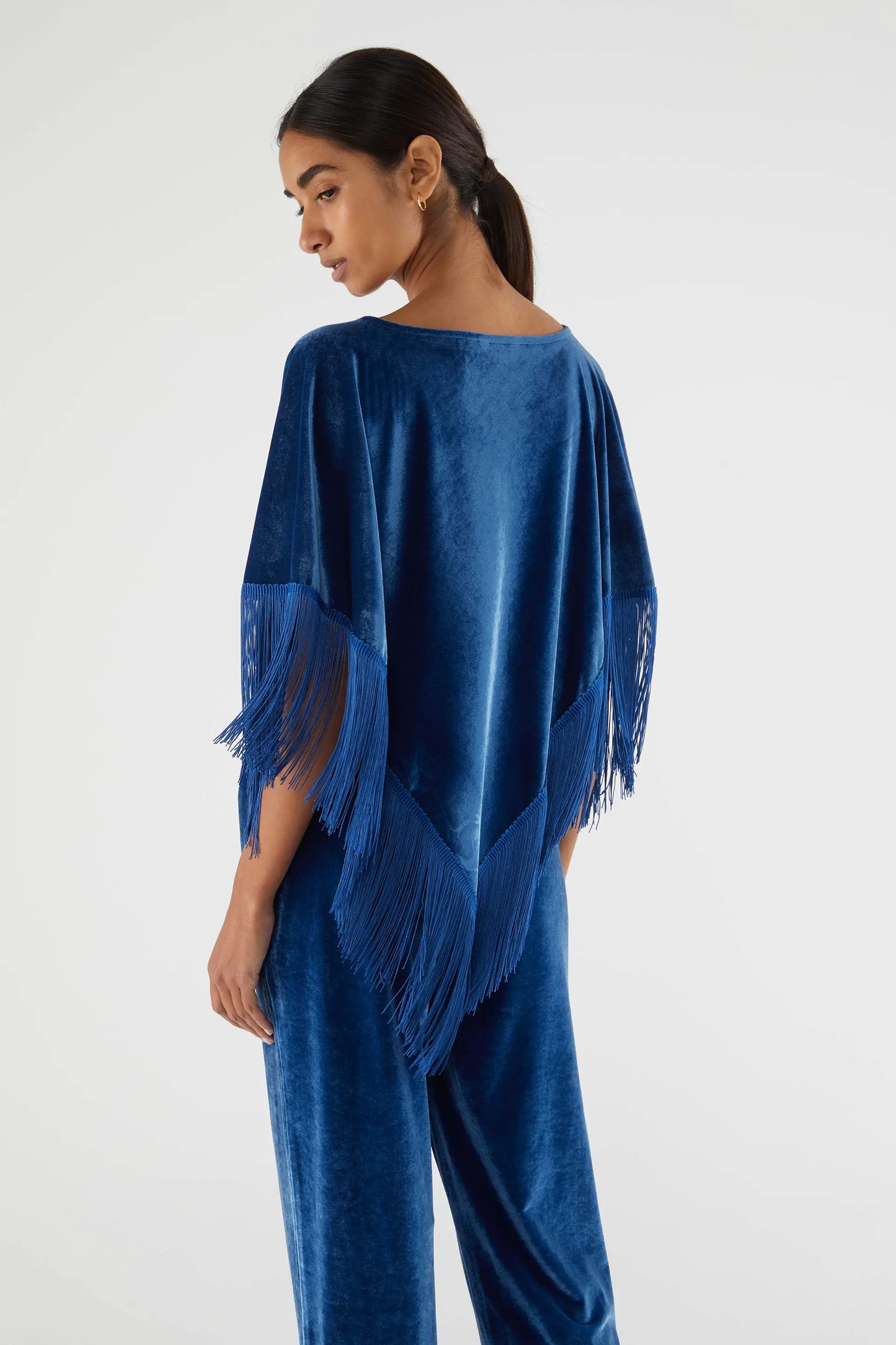 Velvet poncho with blue fringes