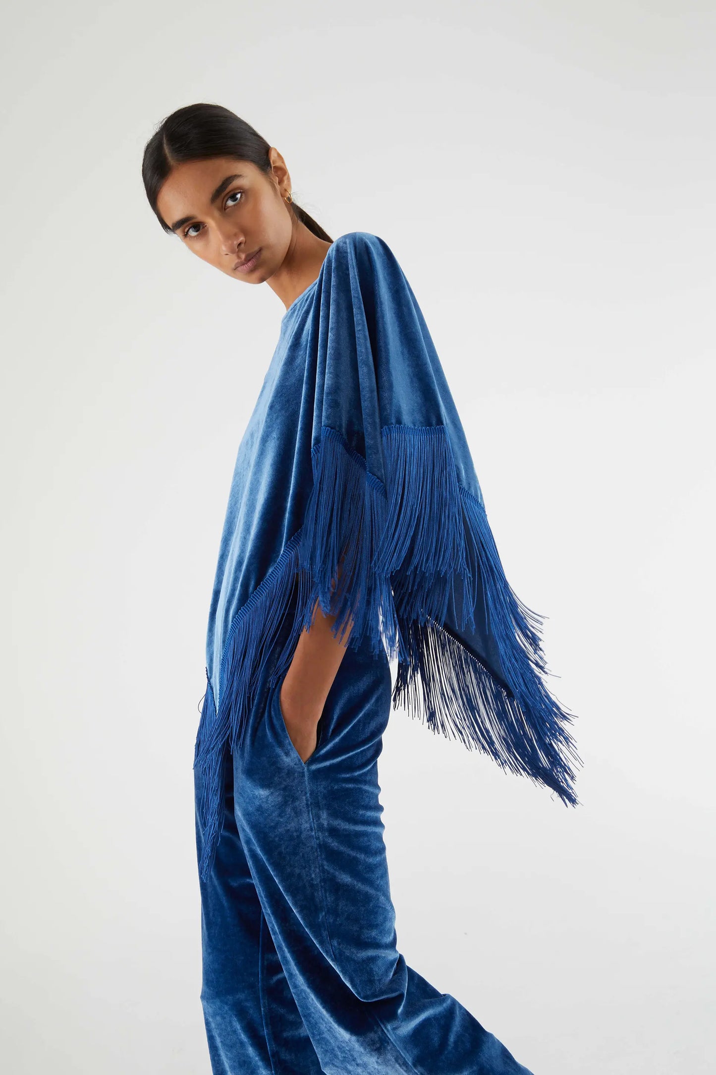 Velvet poncho with blue fringes