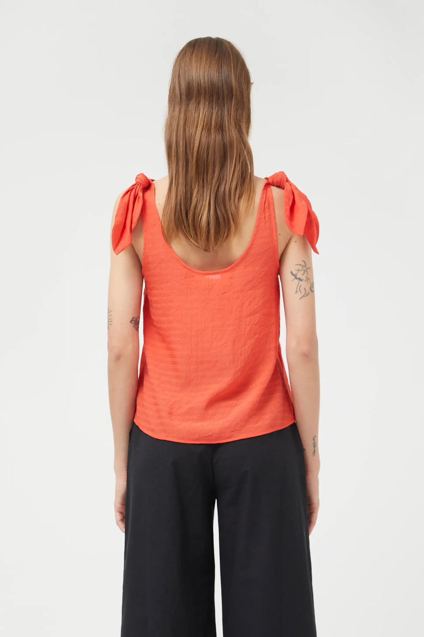 Orange bow strapless top