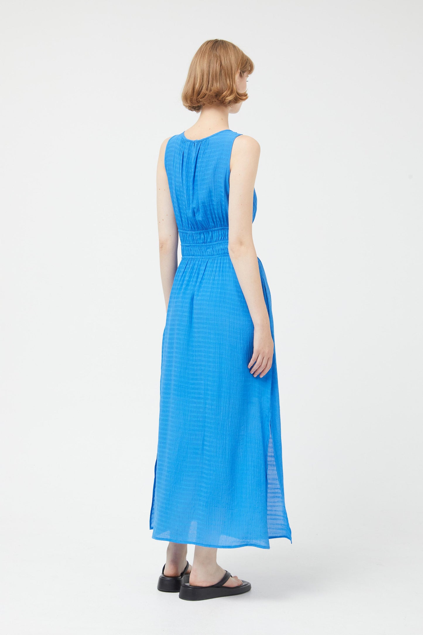 Long blue sleeveless dress