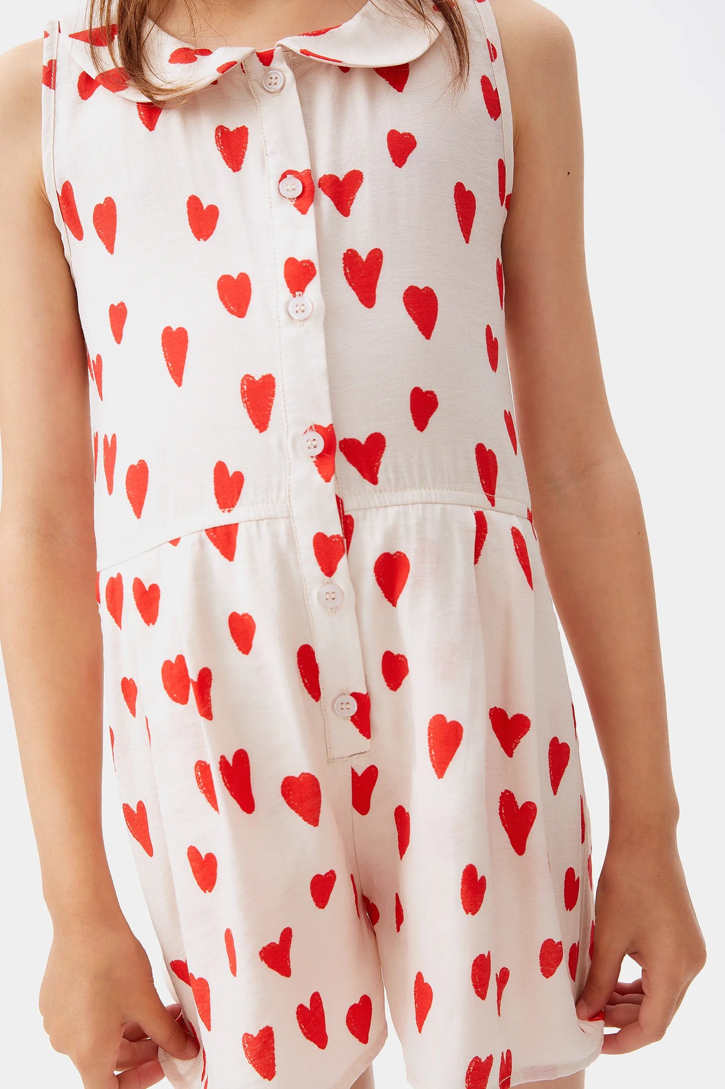 Girl's short jumpsuit with heart print