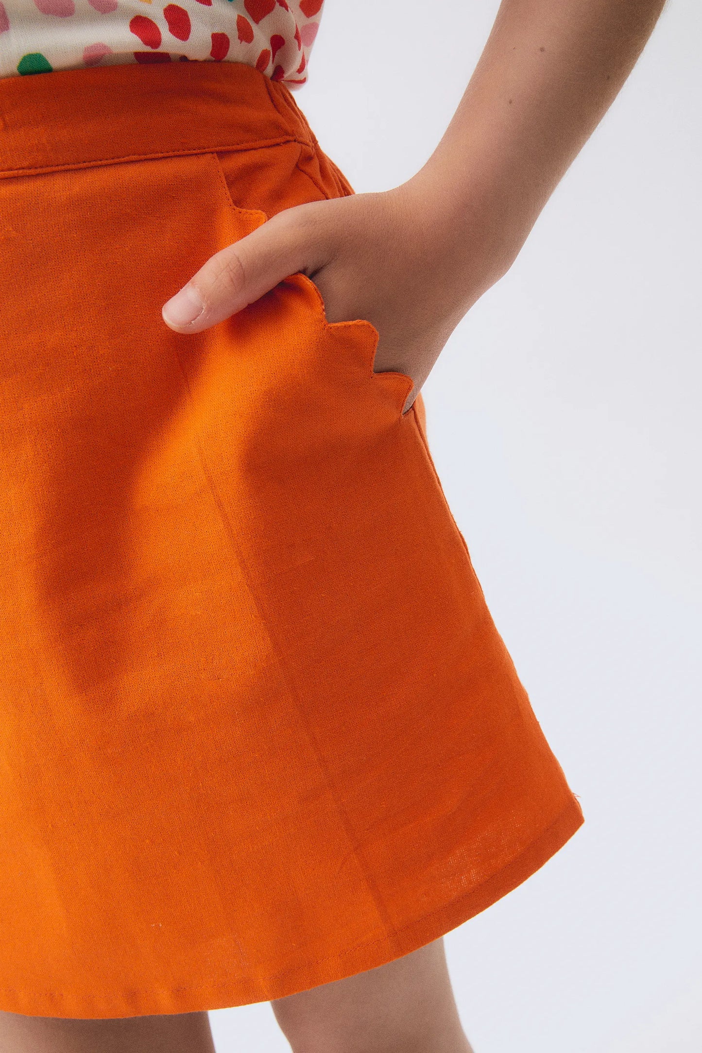 Orange girl's short skirt