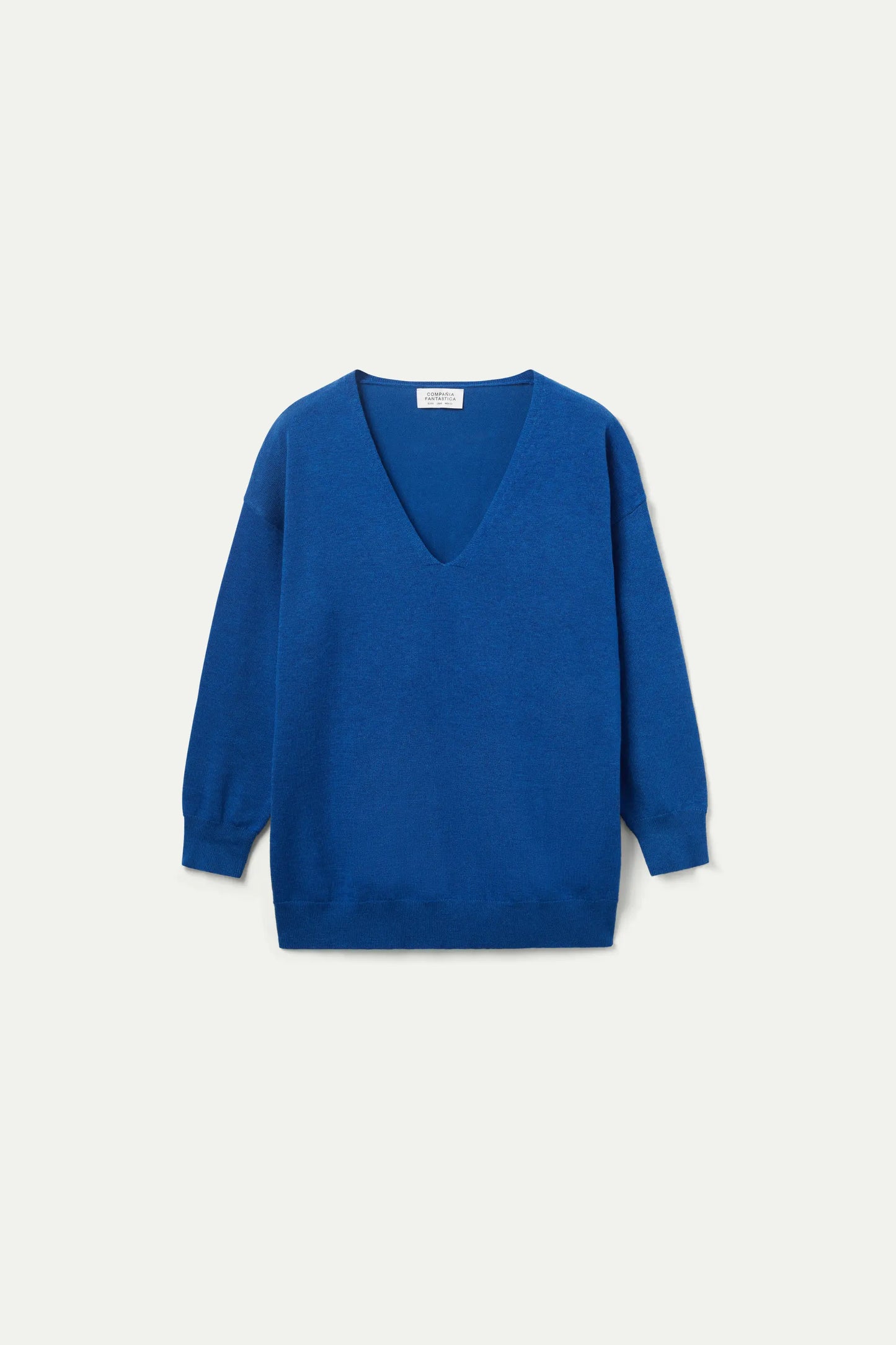 Maglione lavorato a maglia blu con scollo a V