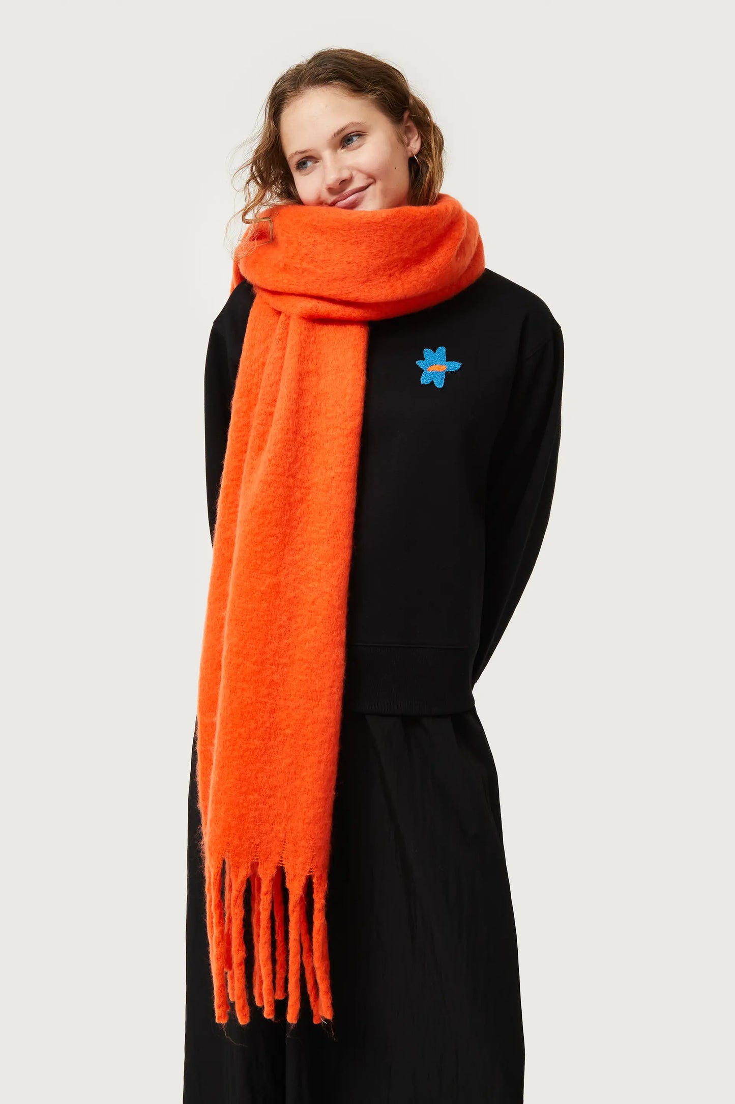 Long scarf with orange fringes