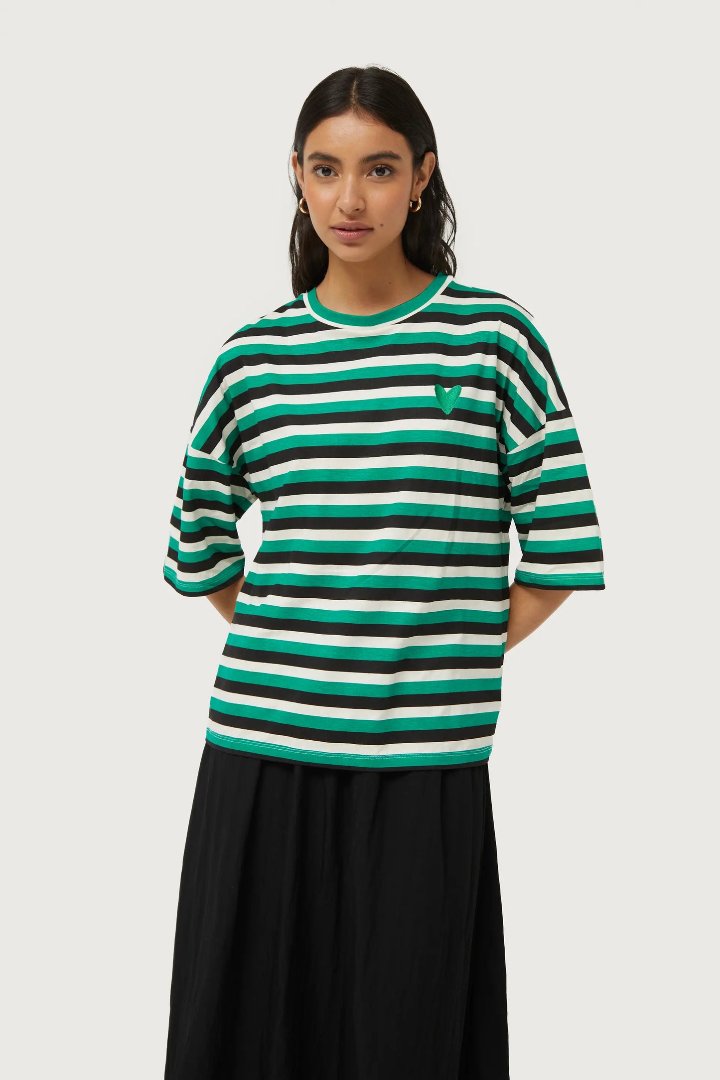 Striped T-shirt with green heart patch