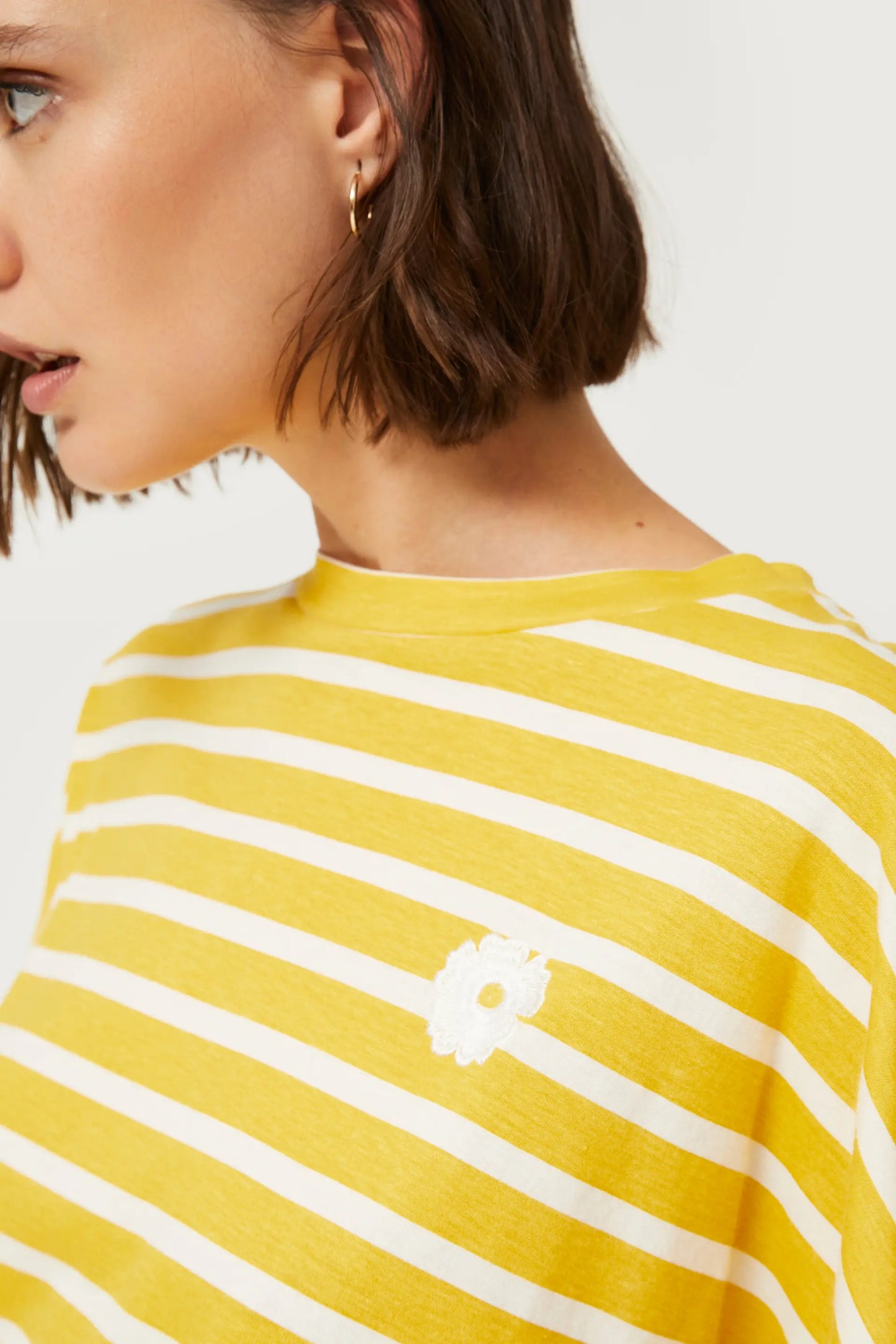 Striped T-shirt with yellow flower patch