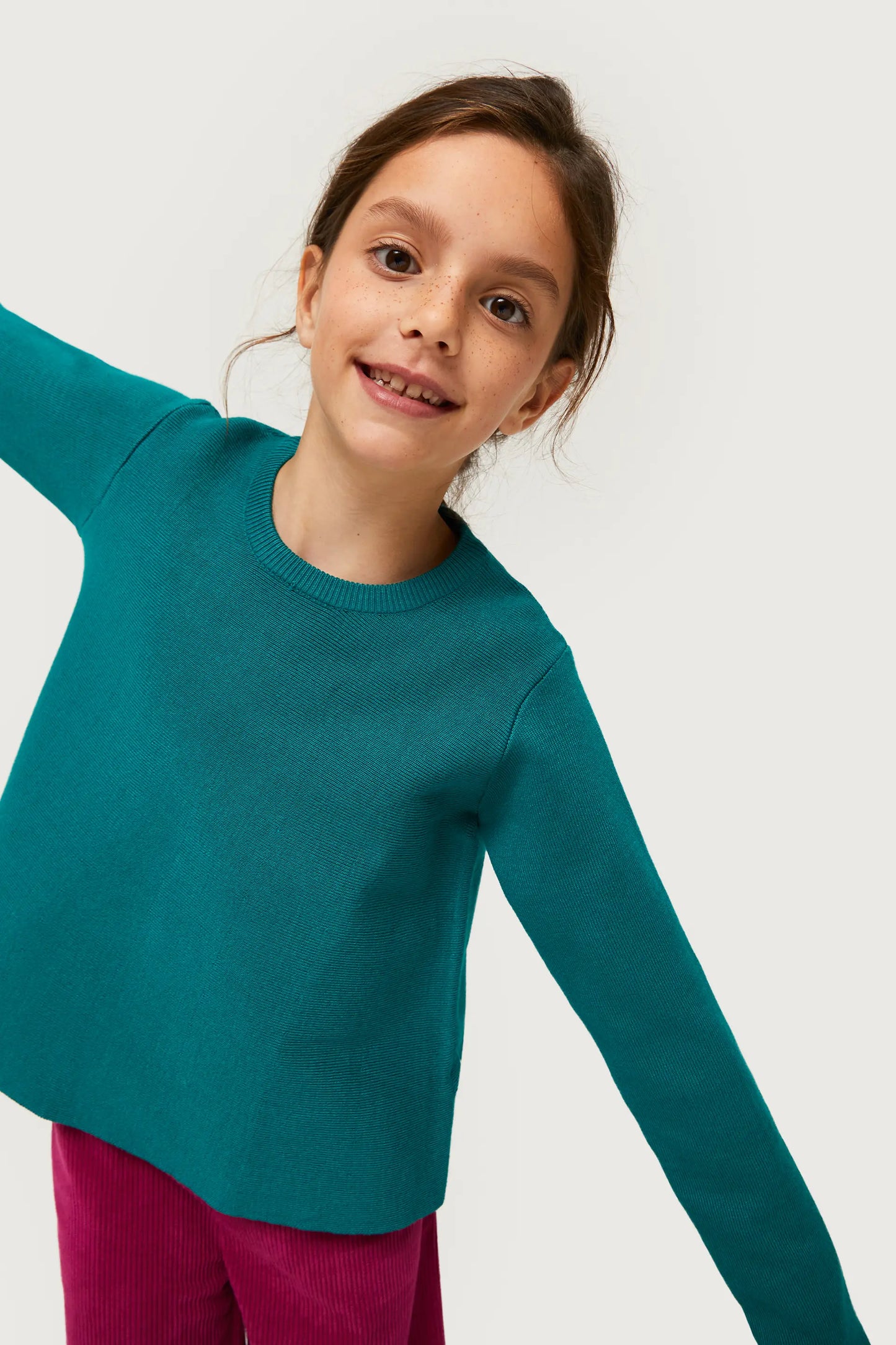 Maglia svasata verde da bambina