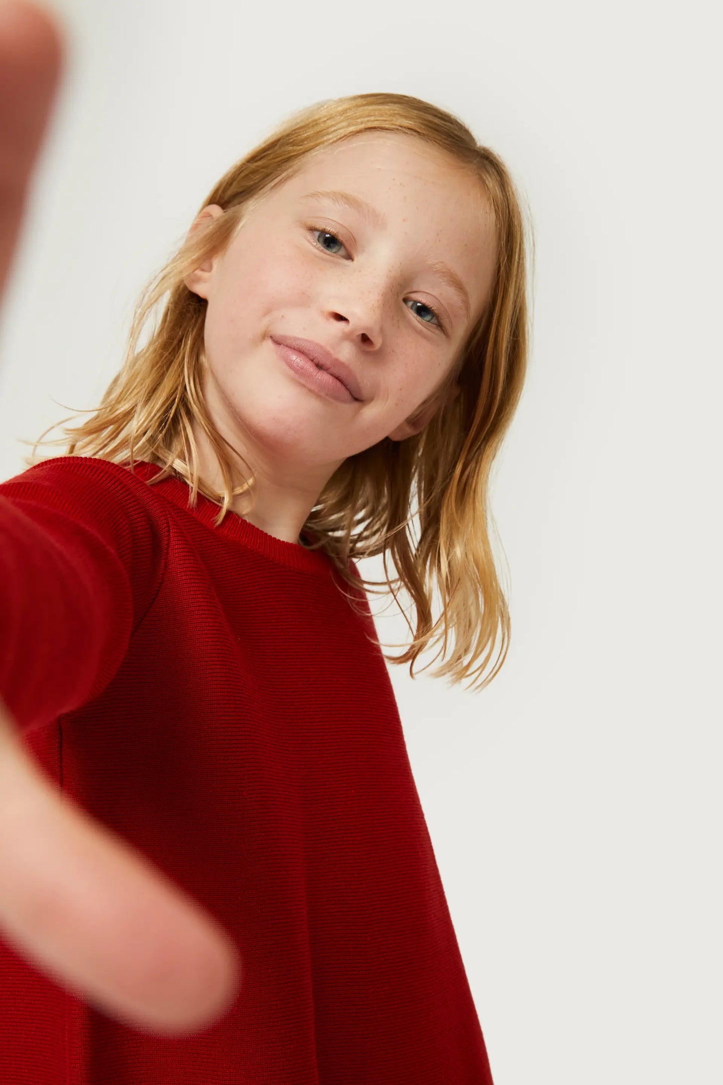 Girl's red flared sweater