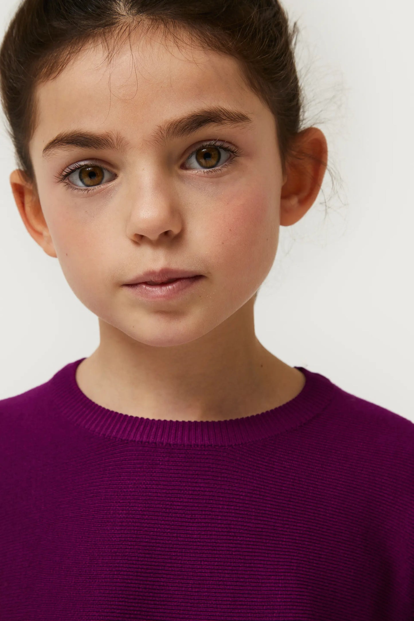 Girl's purple flared sweater