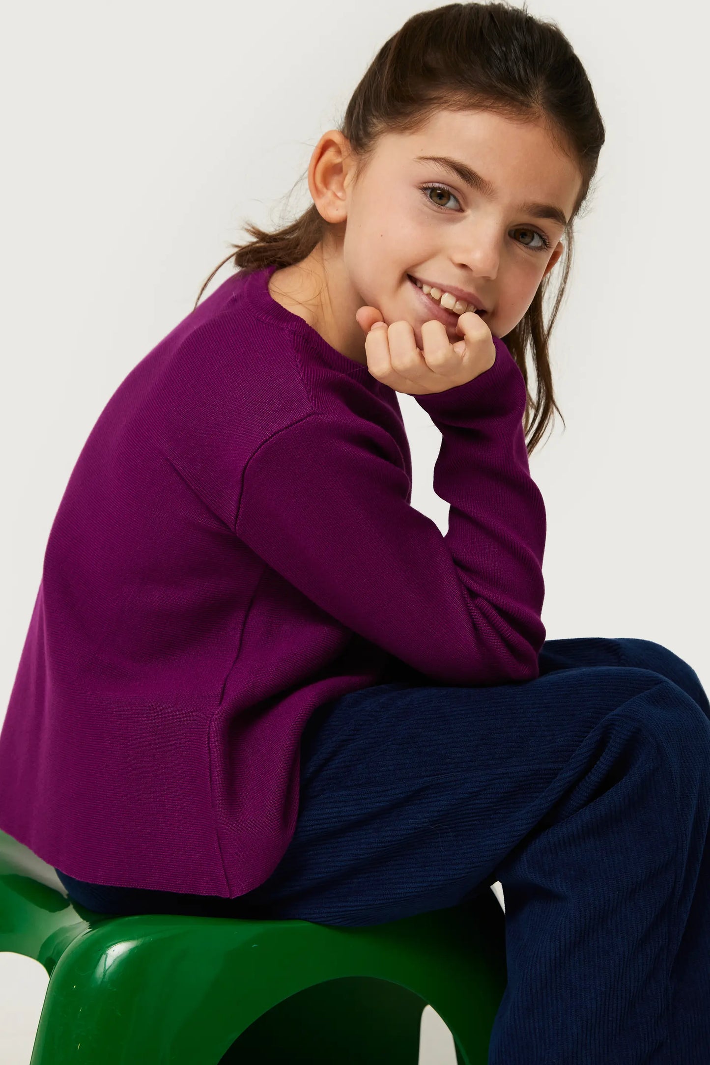 Girl's purple flared sweater