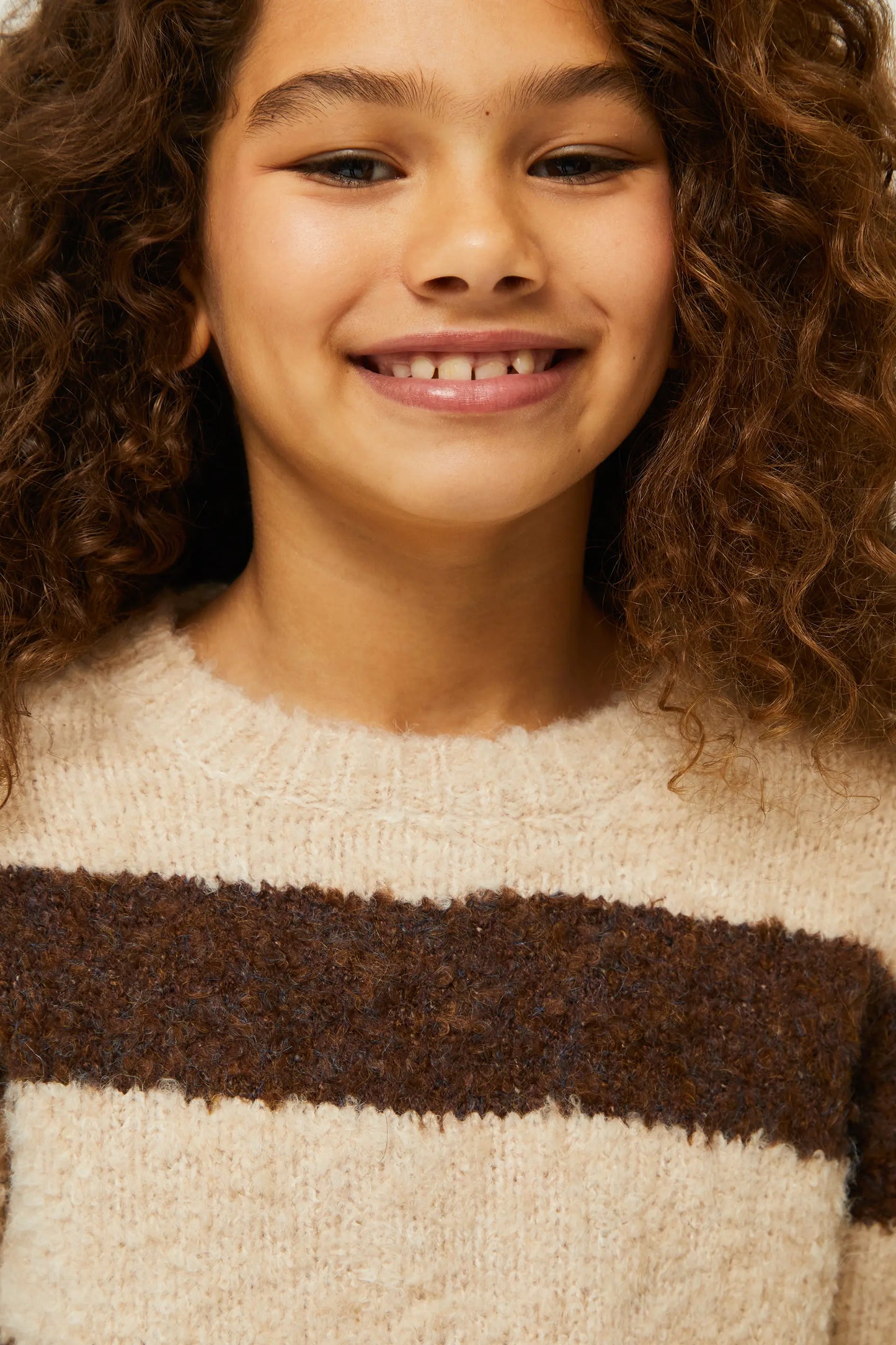 Girl's brown striped sweater