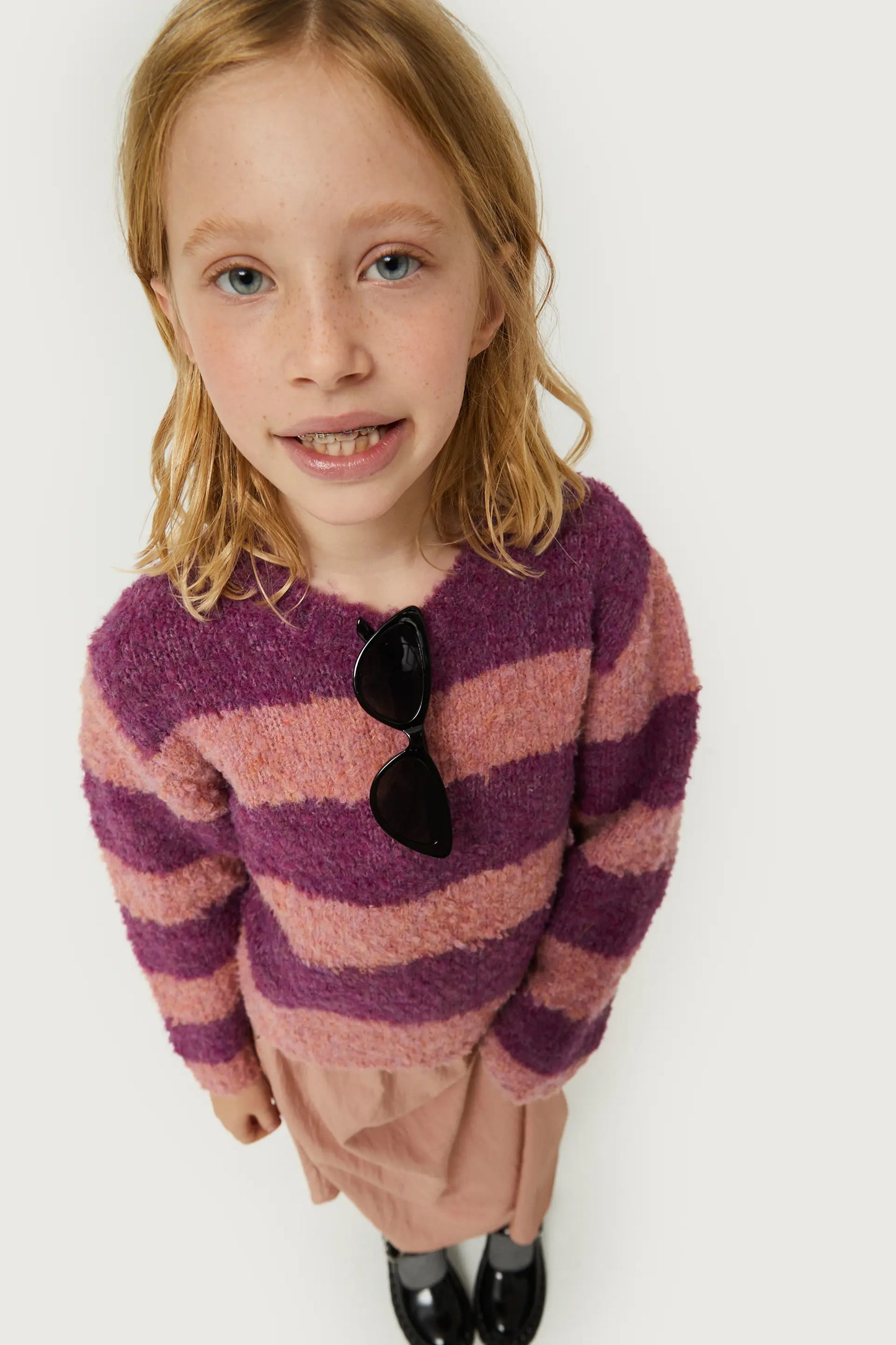 Girl's purple striped sweater