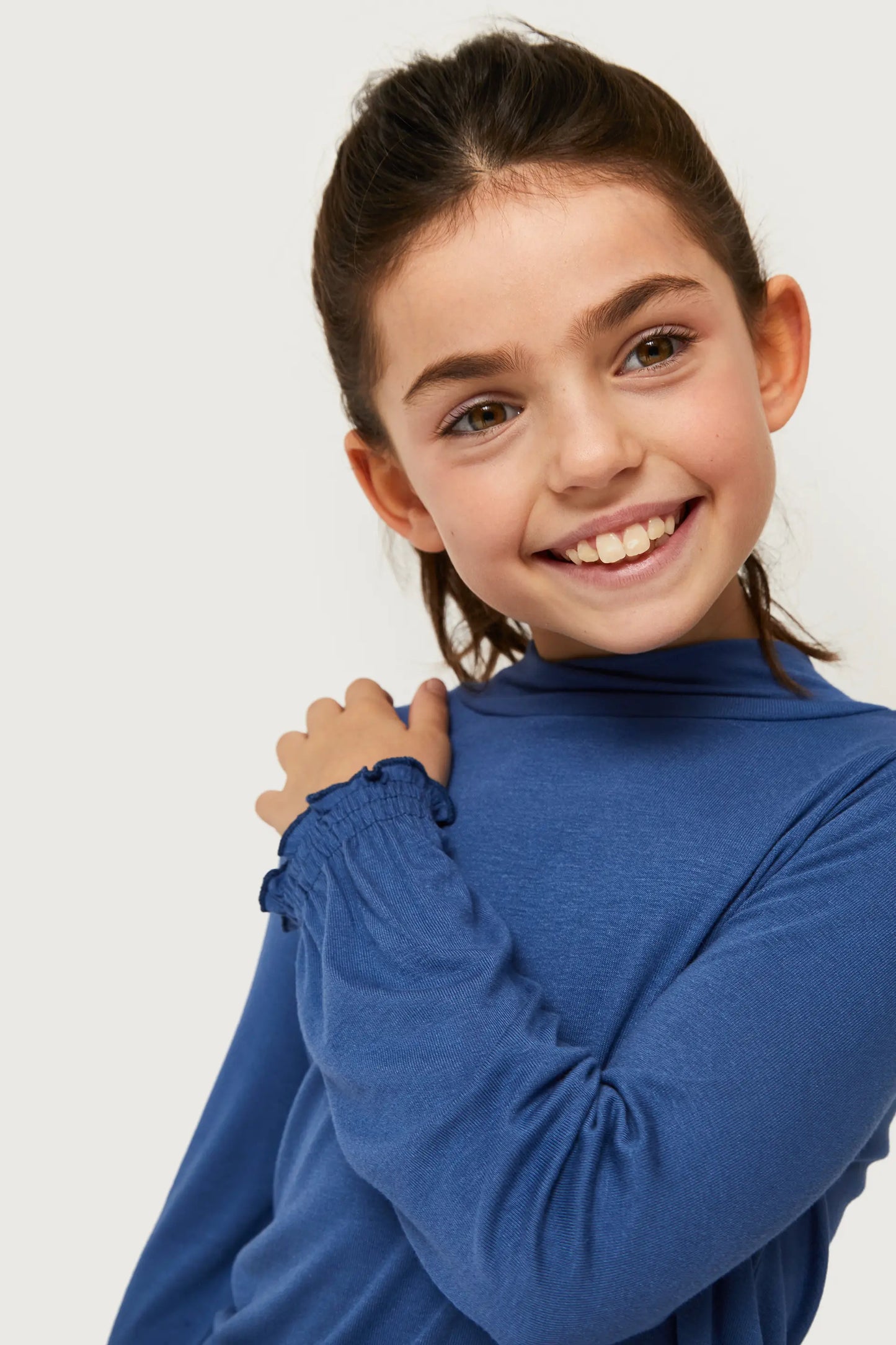 Girl's blue turtleneck top