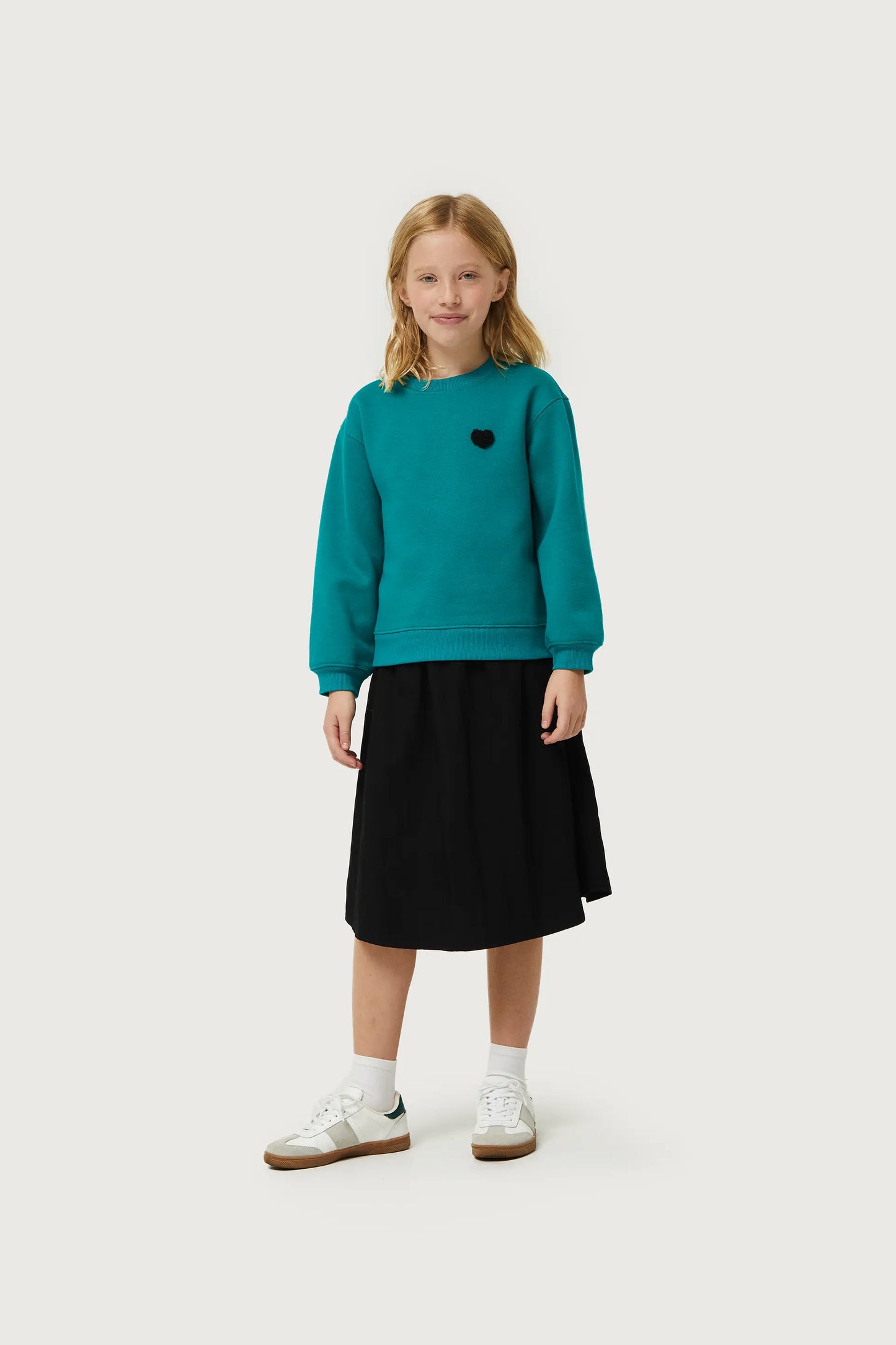 Girl's sweatshirt with green heart patch