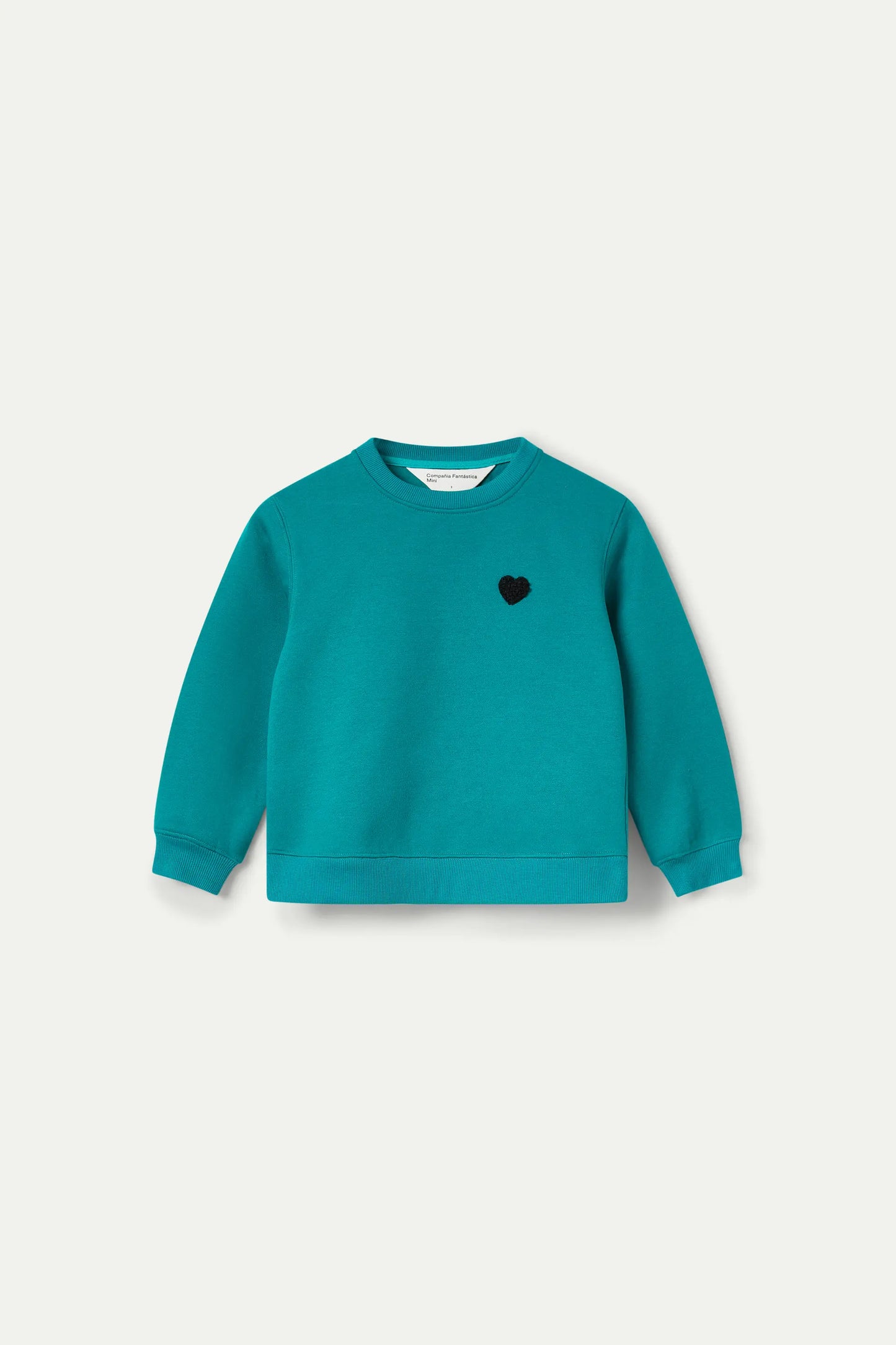 Girl's sweatshirt with green heart patch