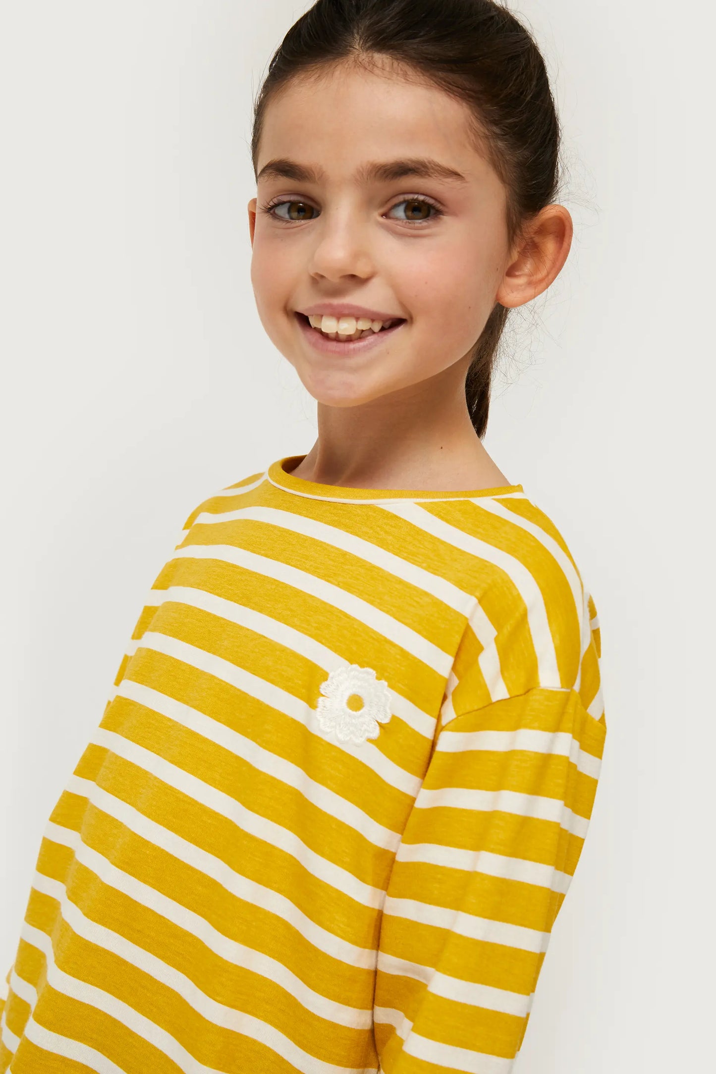 Girl's striped t-shirt with yellow flower patch