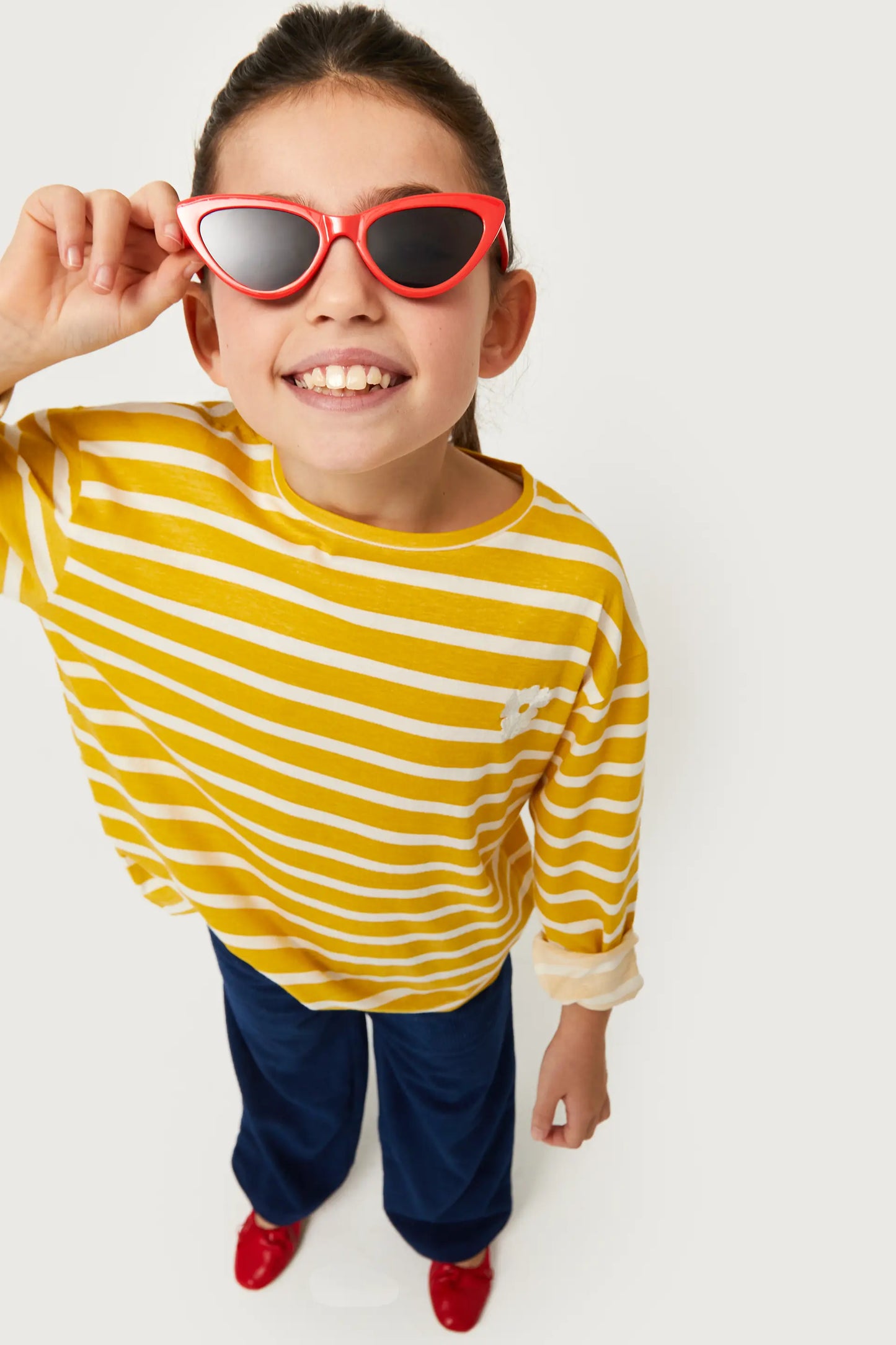 Girl's striped t-shirt with yellow flower patch