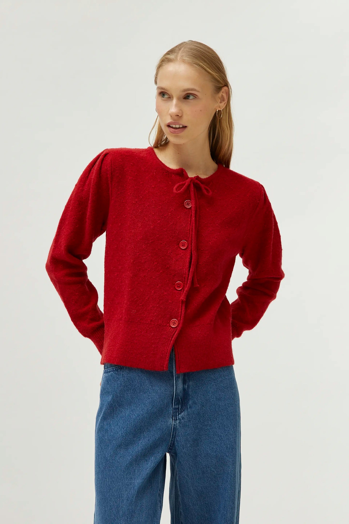 Cardigan in maglia con fiocco rosso