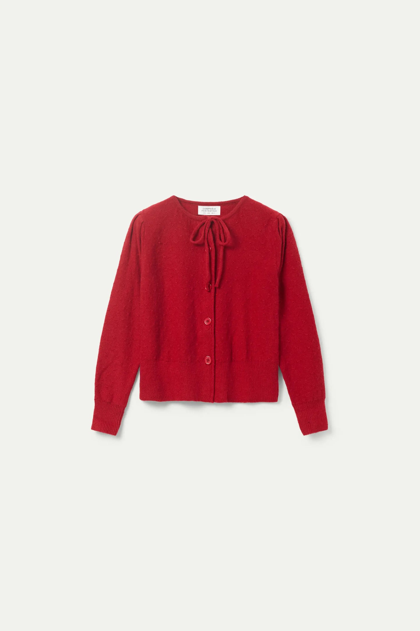 Cardigan in maglia con fiocco rosso