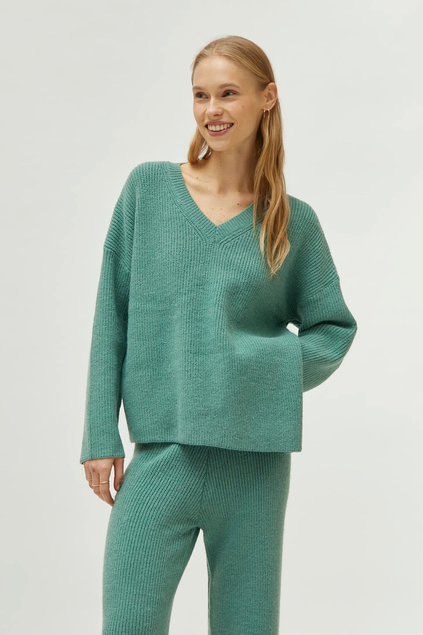 Green V-neck sweater