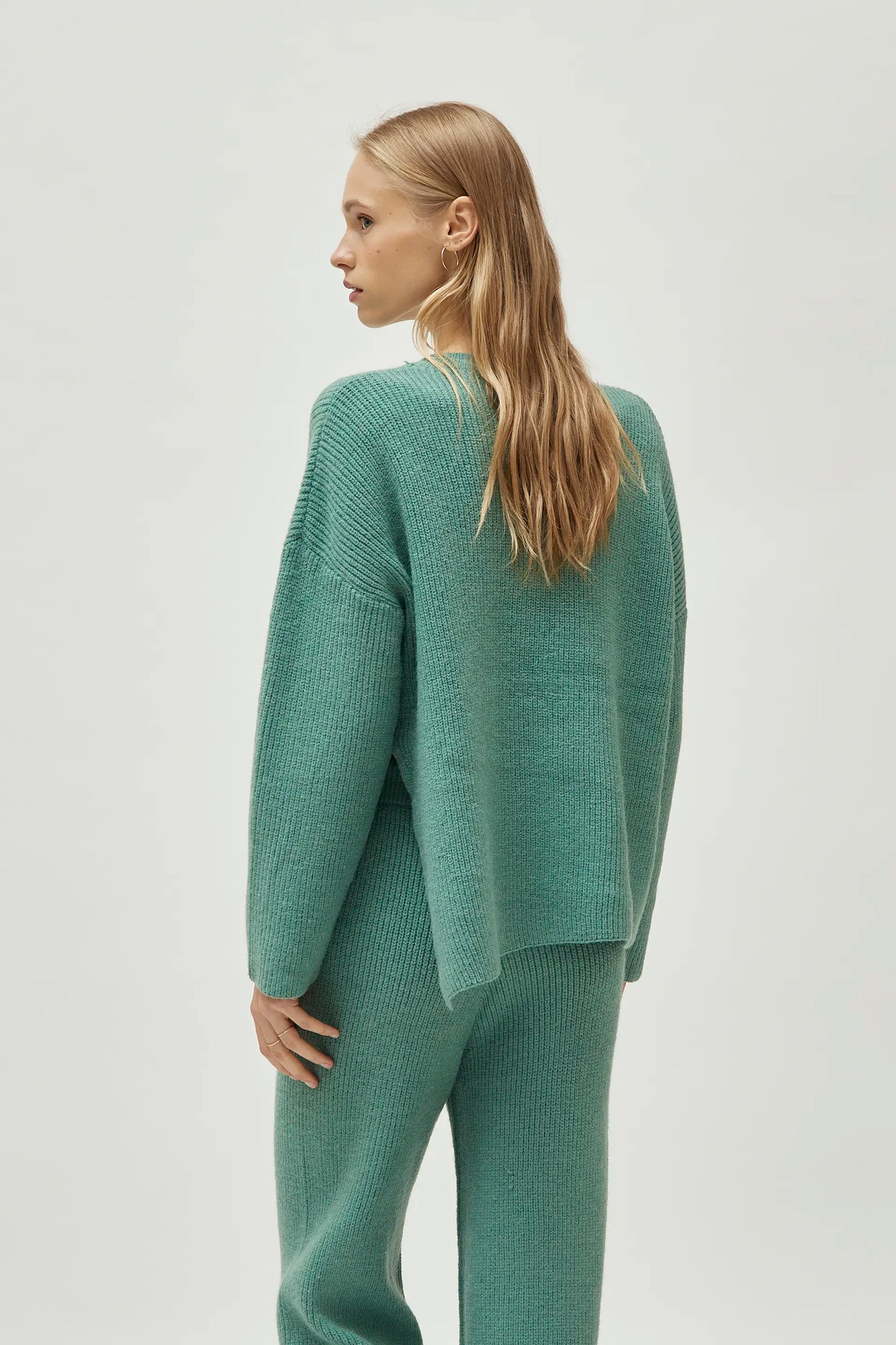 Green V-neck sweater