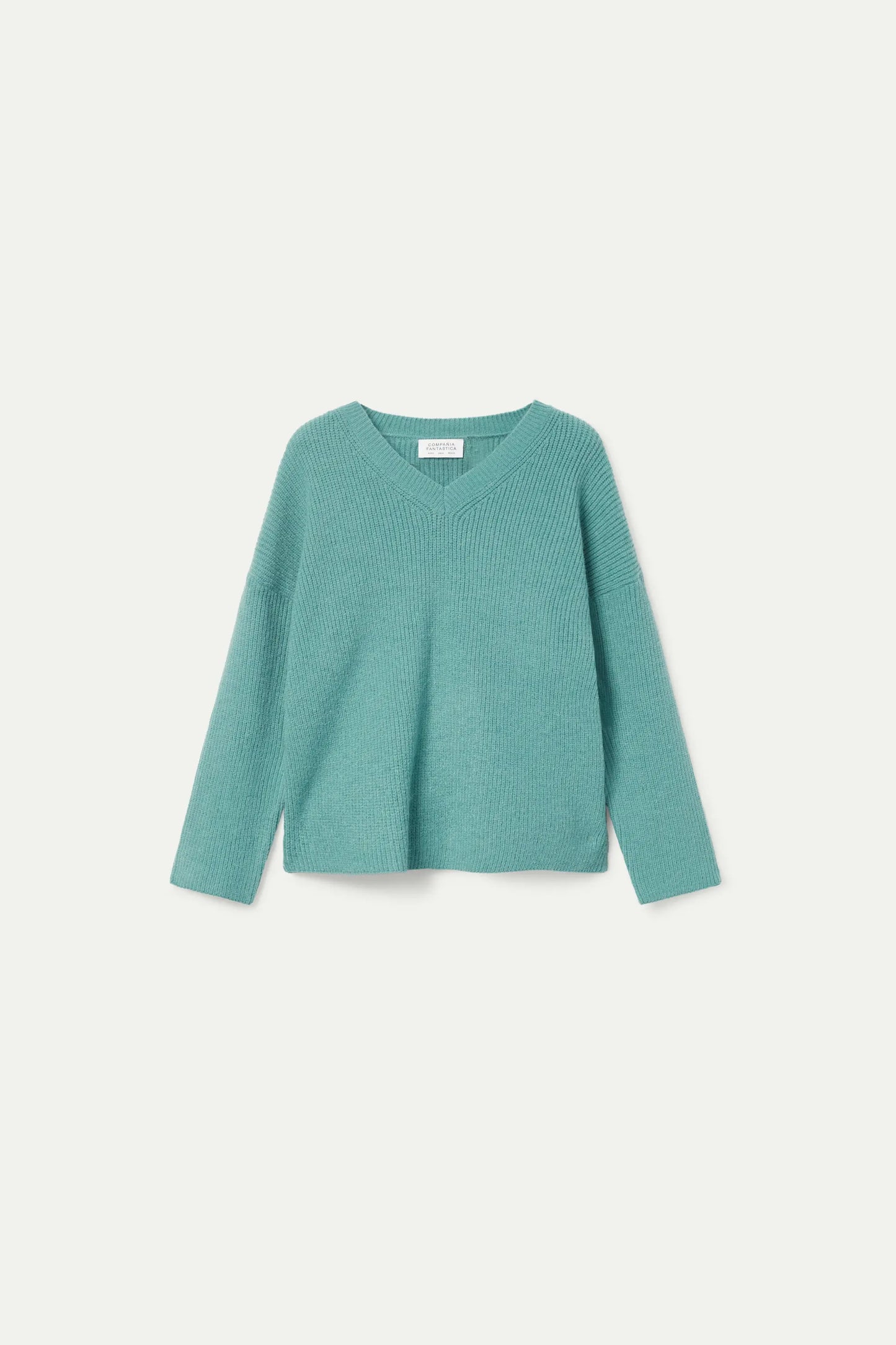 Green V-neck sweater