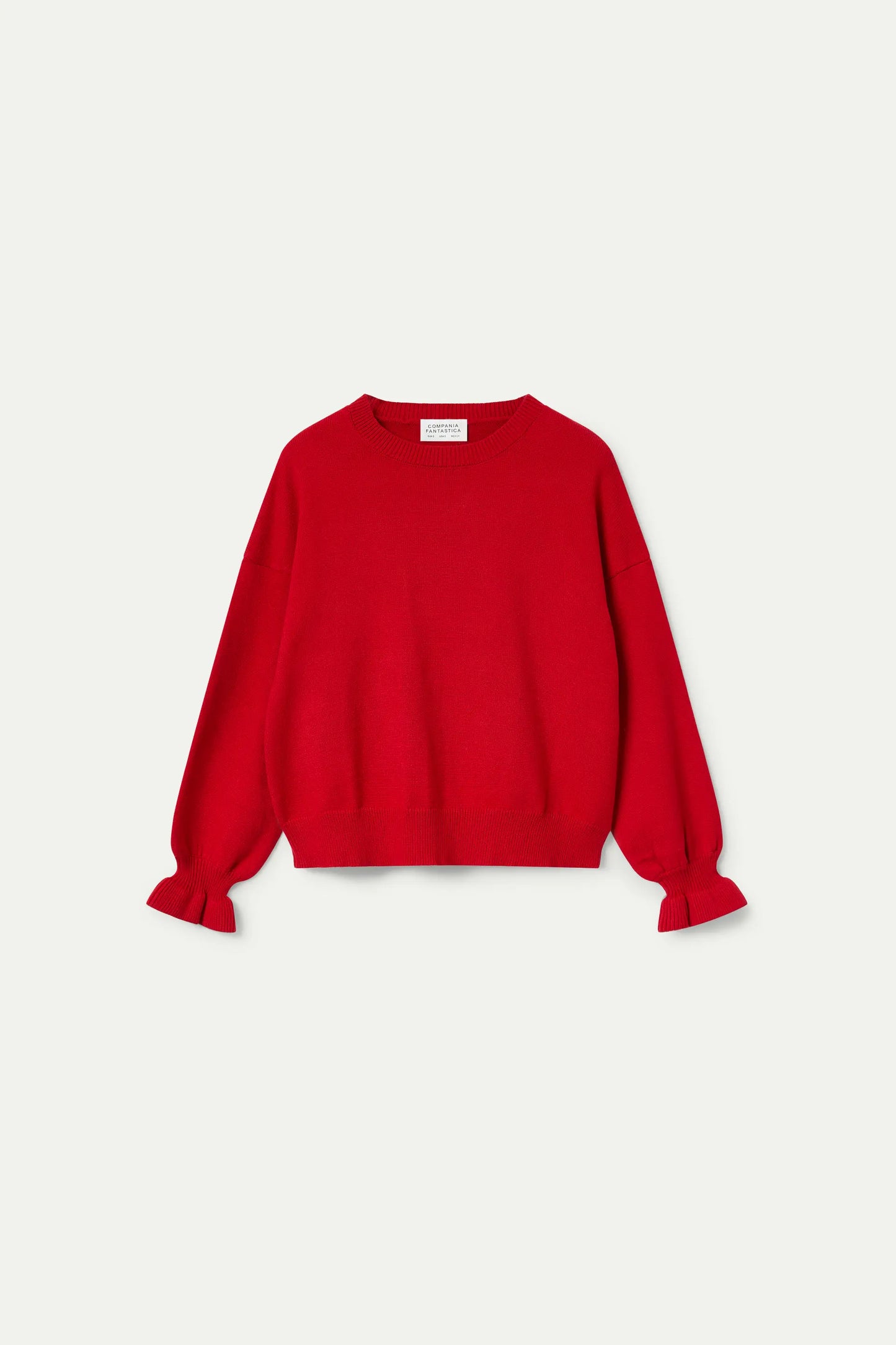 Maglione rosso con dettaglio polsini