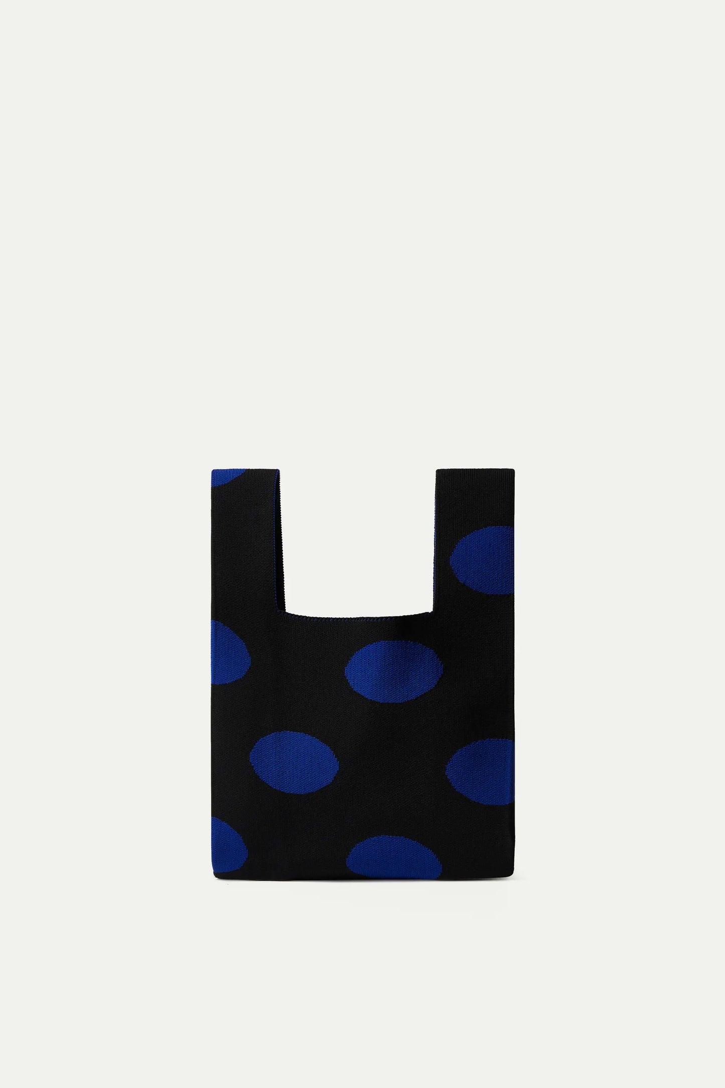 Borsa a mano blu con stampa a pois