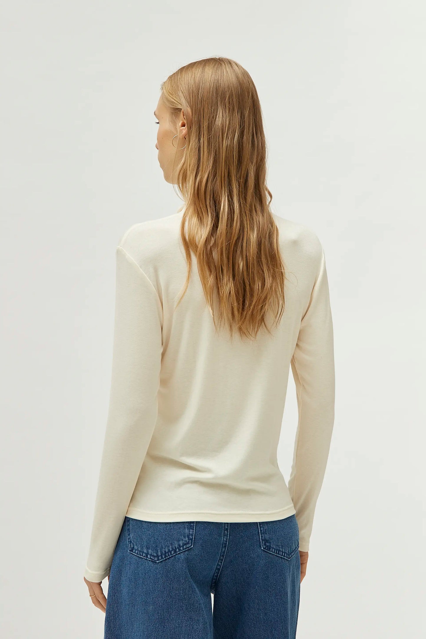 White mock neck top