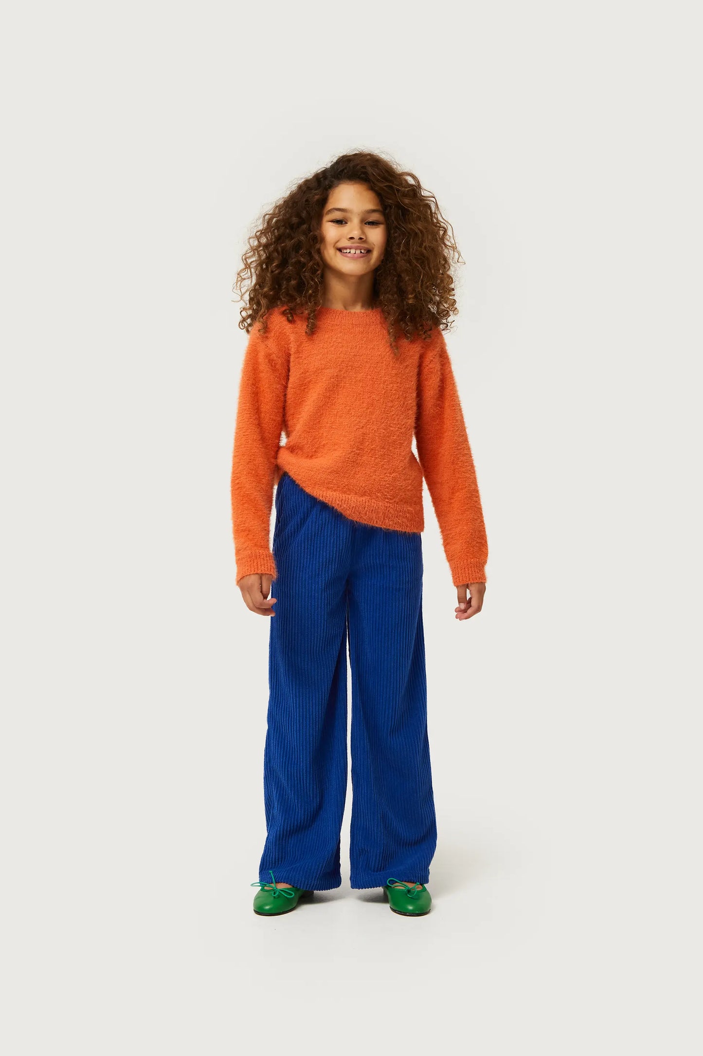 Girl's knitted sweater with orange texture