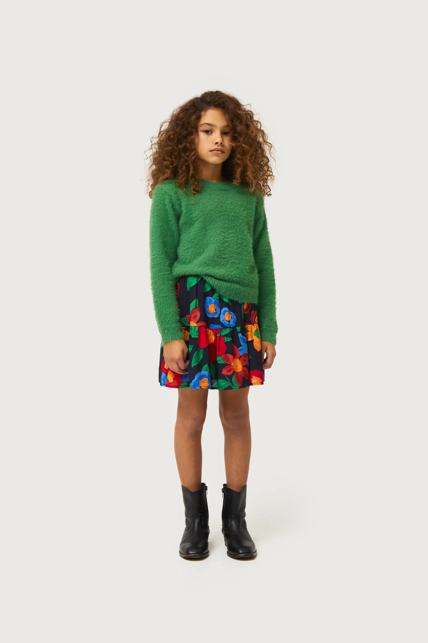 Girl's knitted sweater with green texture