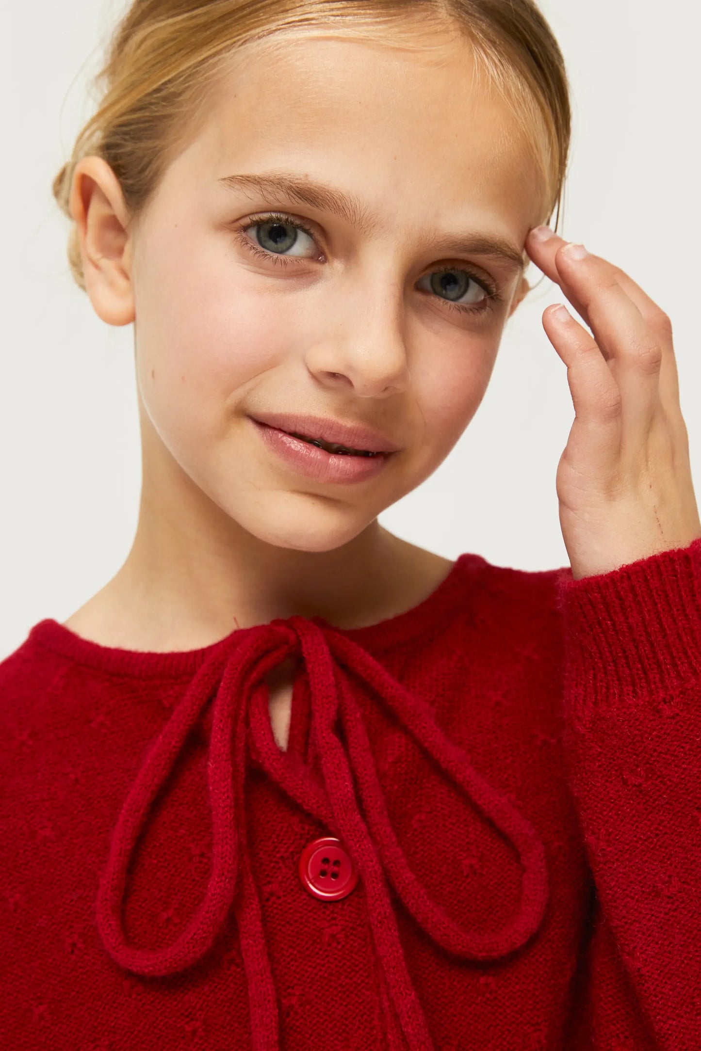 Girl's cardigan with red bow