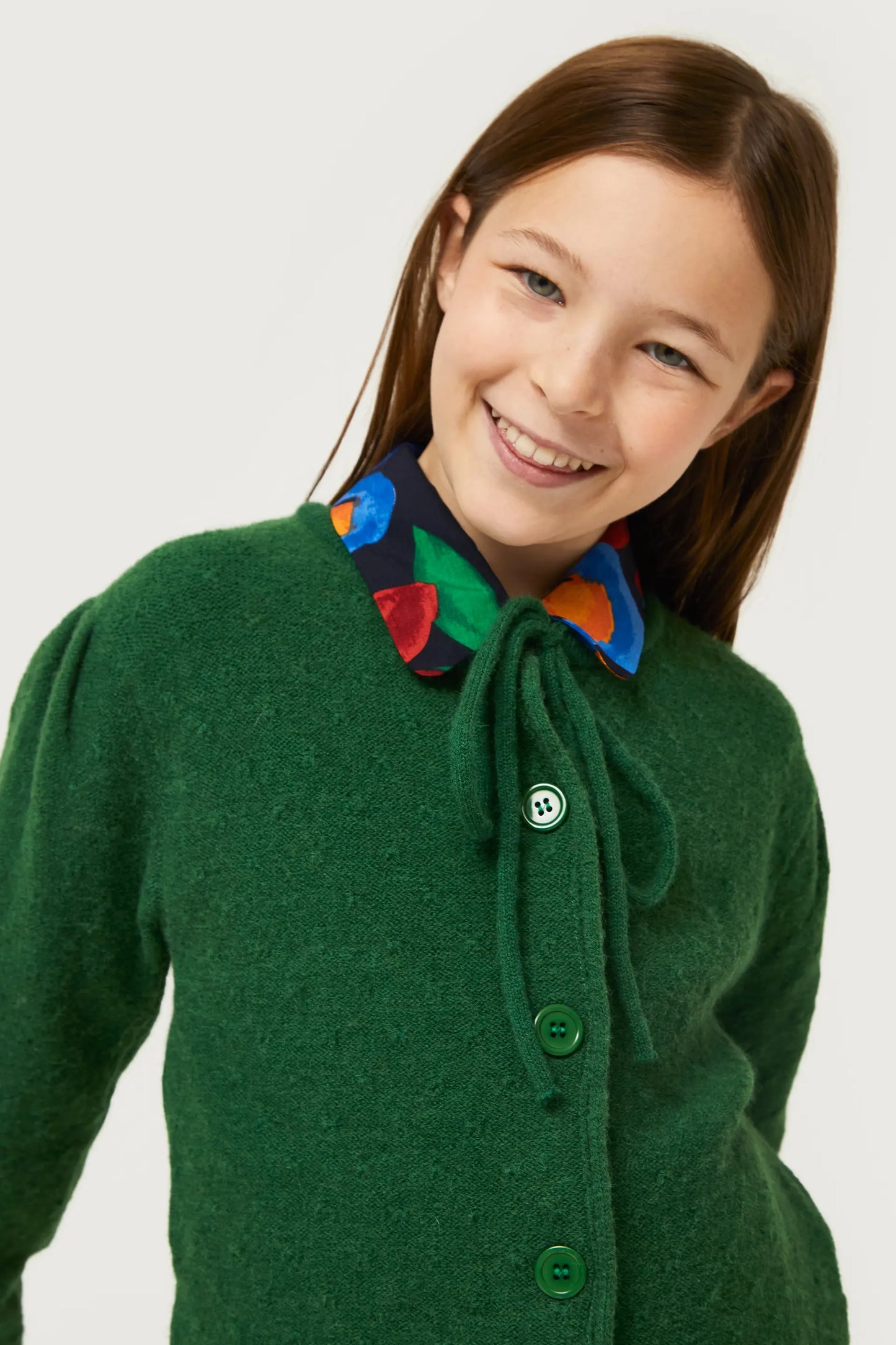 Girl's cardigan with green bow