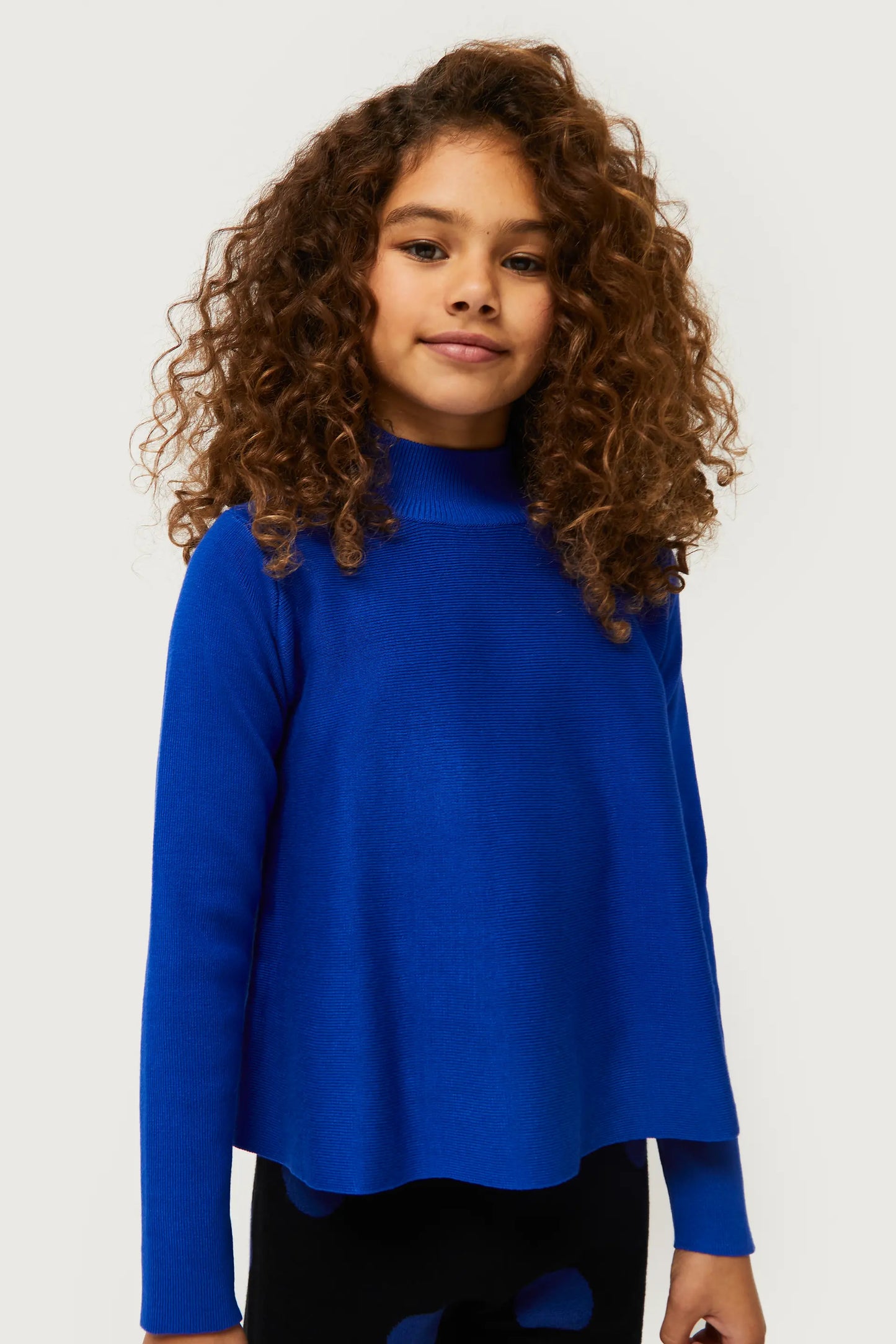 Girl's flared blue Perkins neck sweater