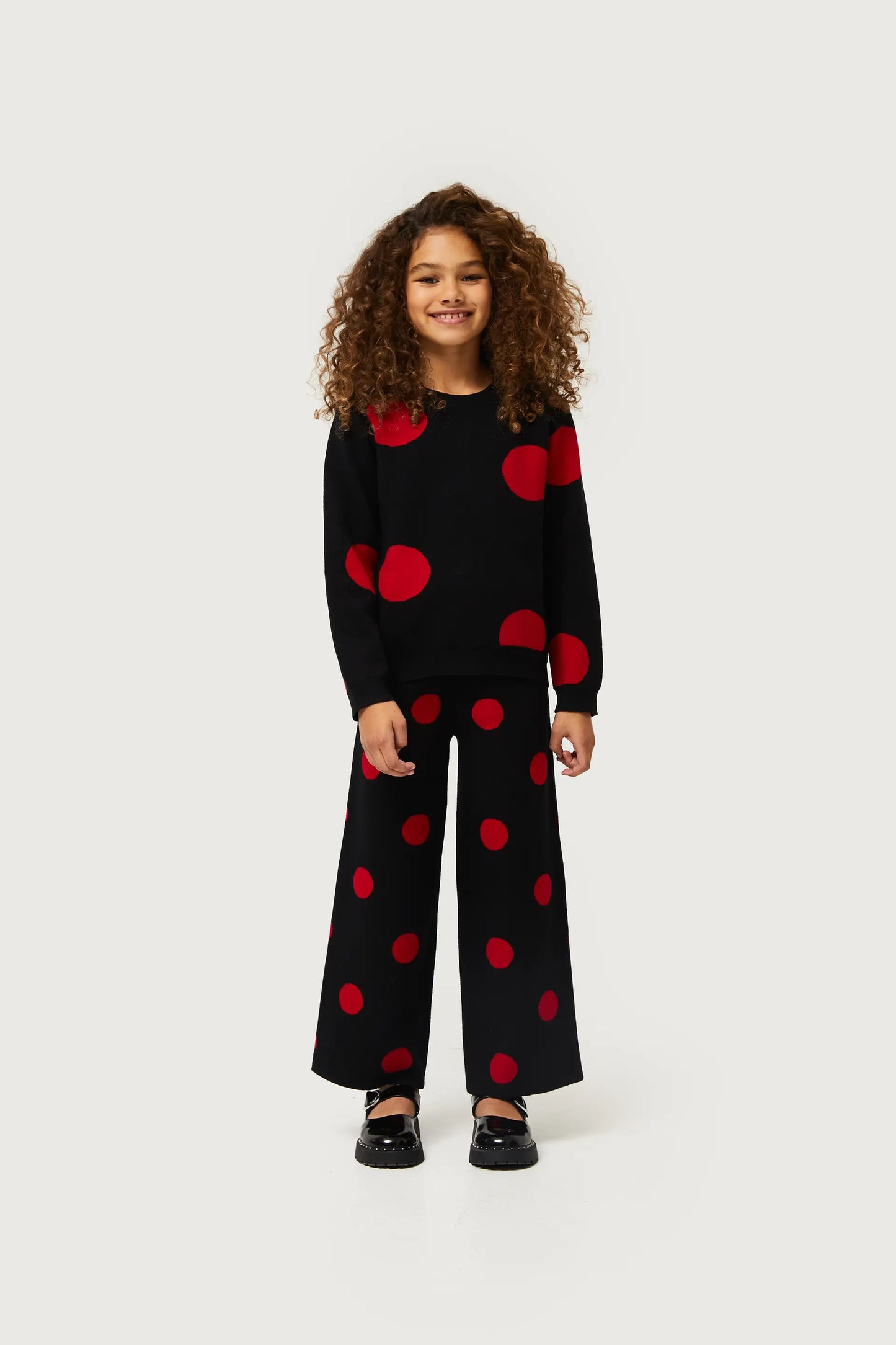 Maglione da bambina in maglia jacquard stampata a pois rossi