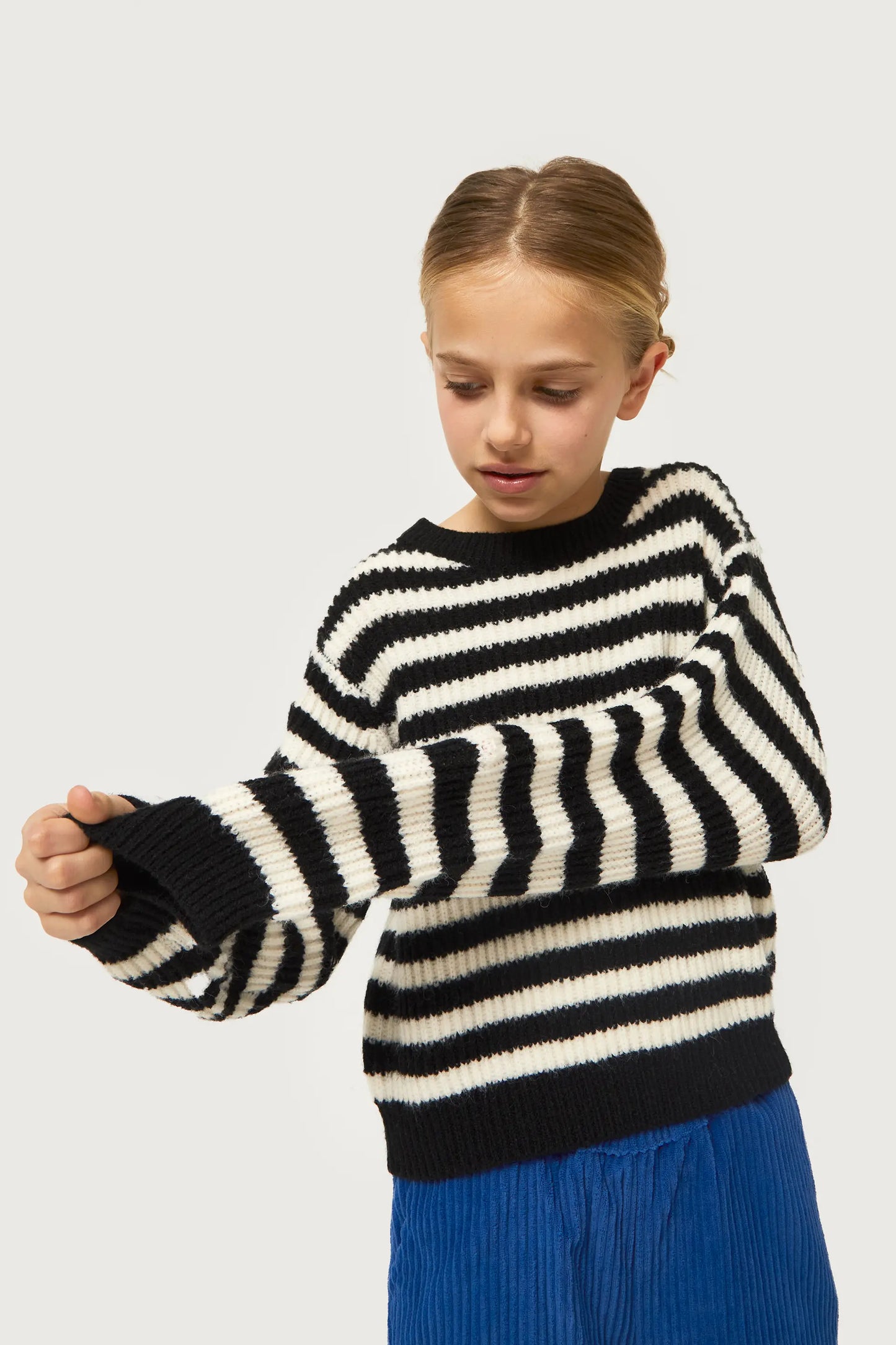 Girl's black striped knitted sweater