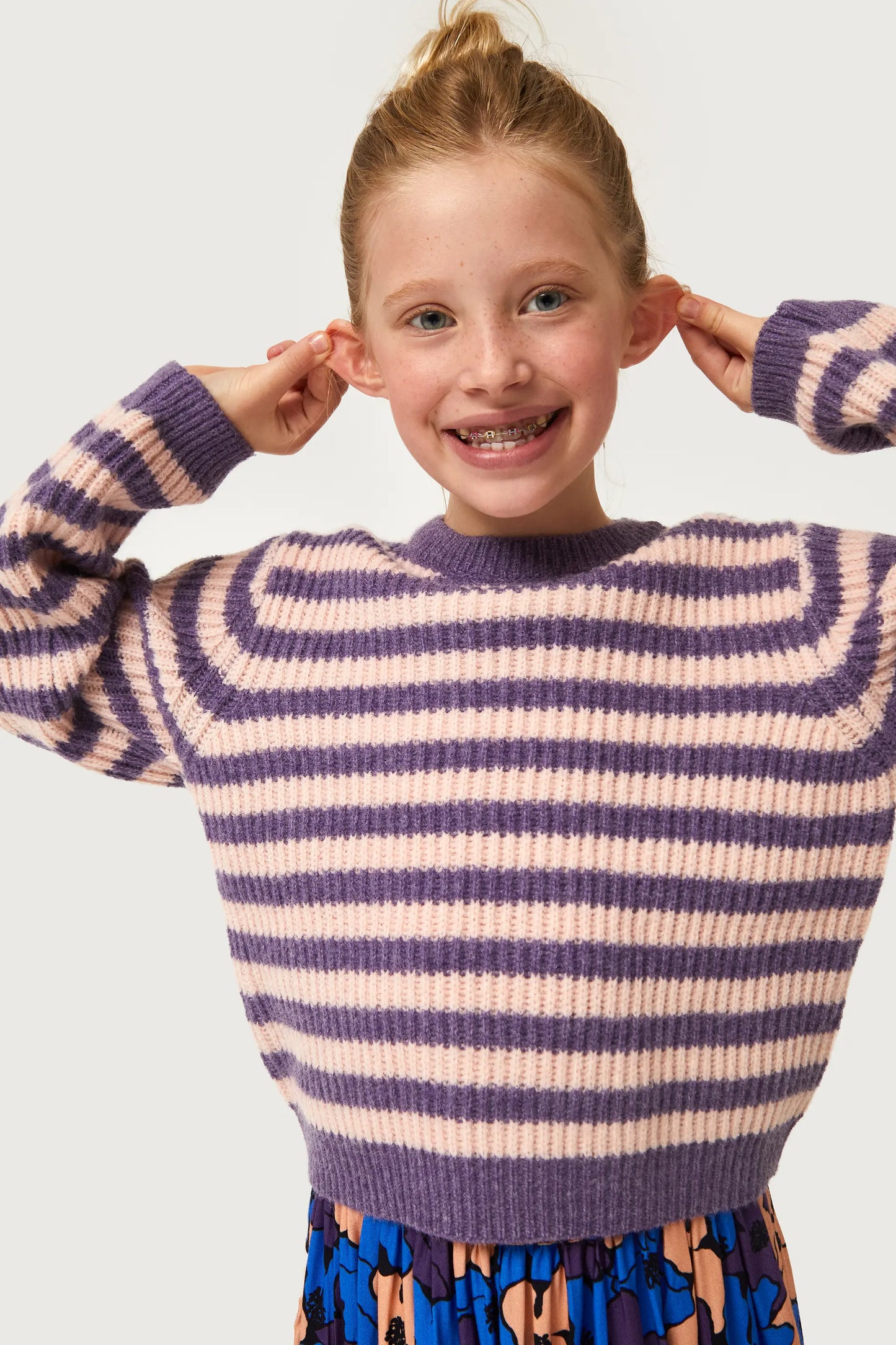 Girl's purple striped knit sweater